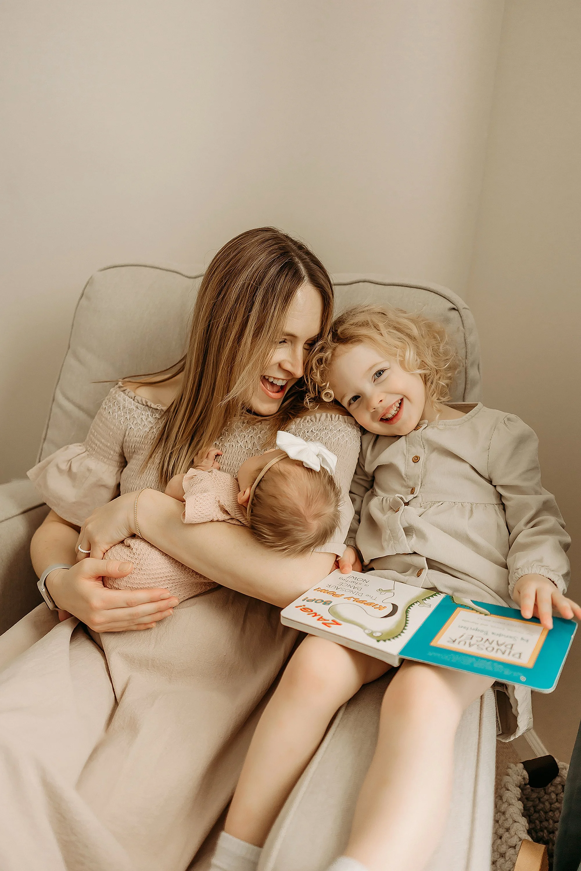 Mom wearing a comfortable neutral dress during newborn photos