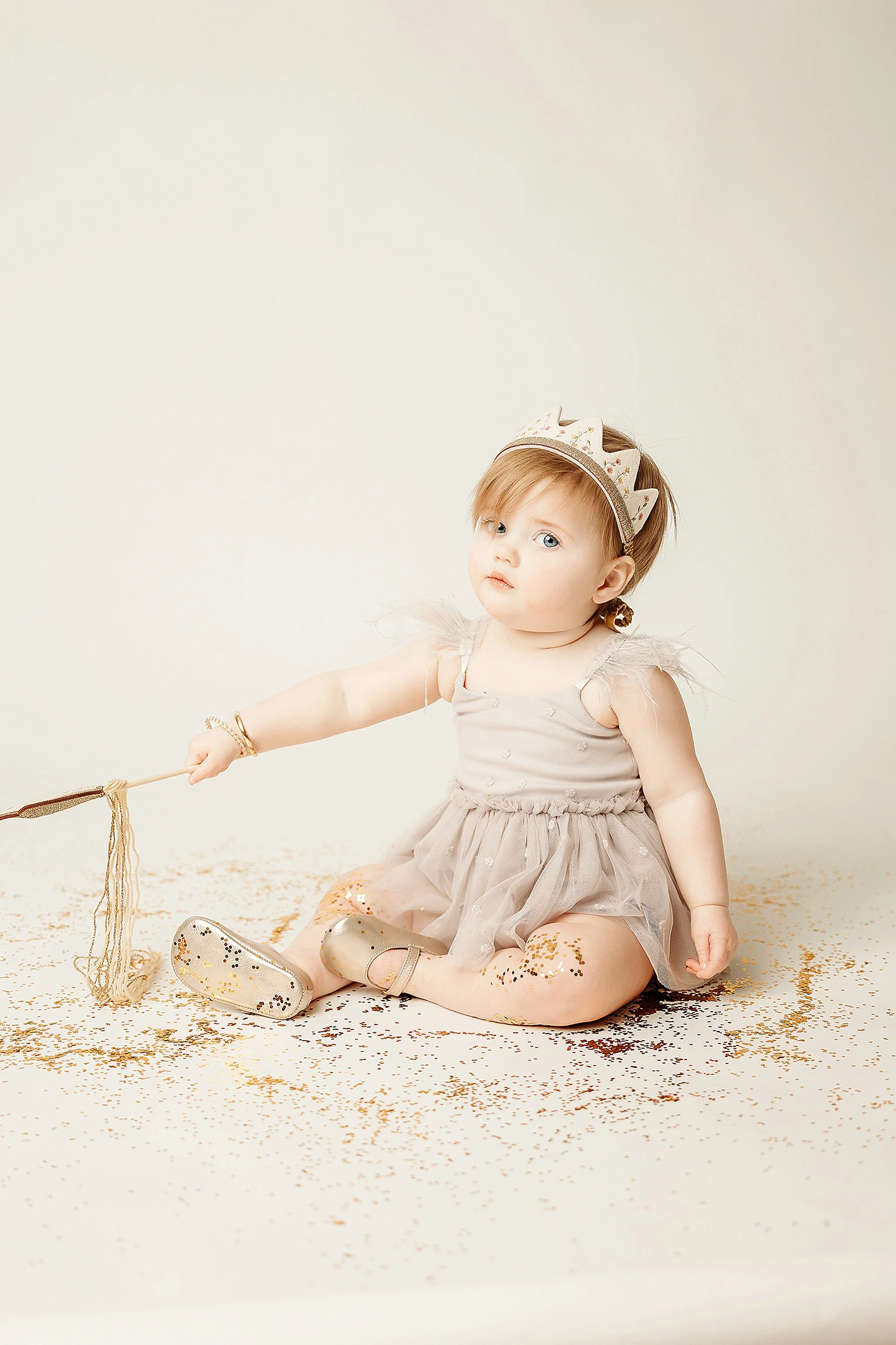 first birthday photo session with glitter for toddler