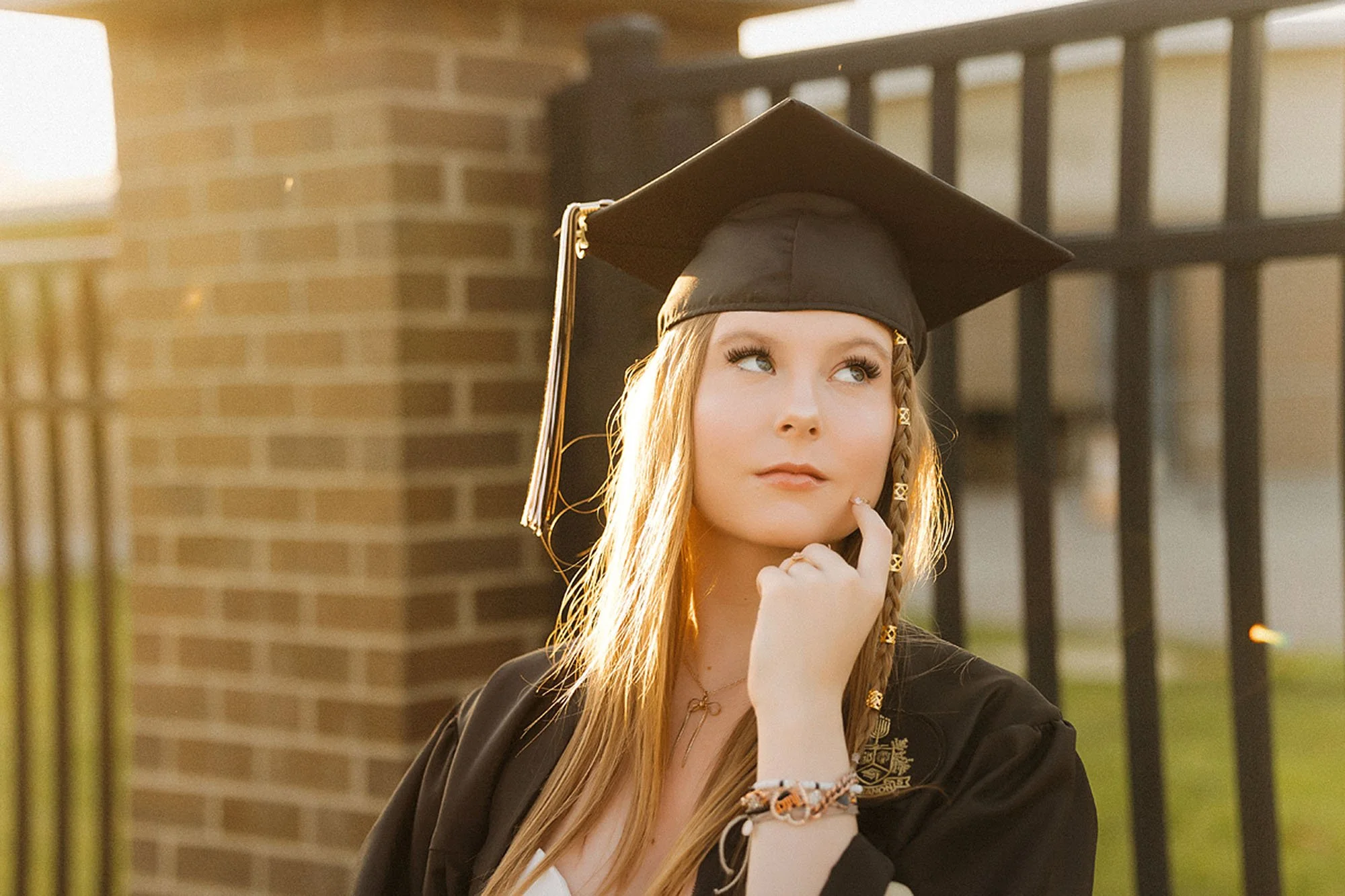 Lebanon Senior Photos showcasing a graduating high school senior in a cap and gown during a golden-hour outdoor portrait session, creating timeless graduation photos with natural light and authentic style