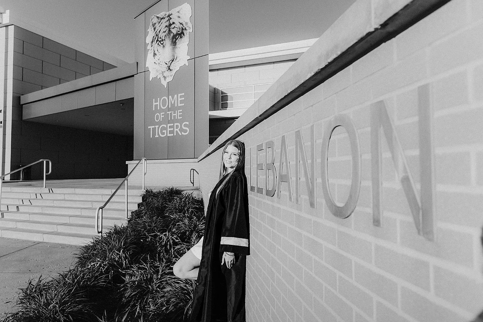 Elegant Lebanon senior photos of a high school graduate posing outside the Home of the Tigers entrance at Lebanon High School