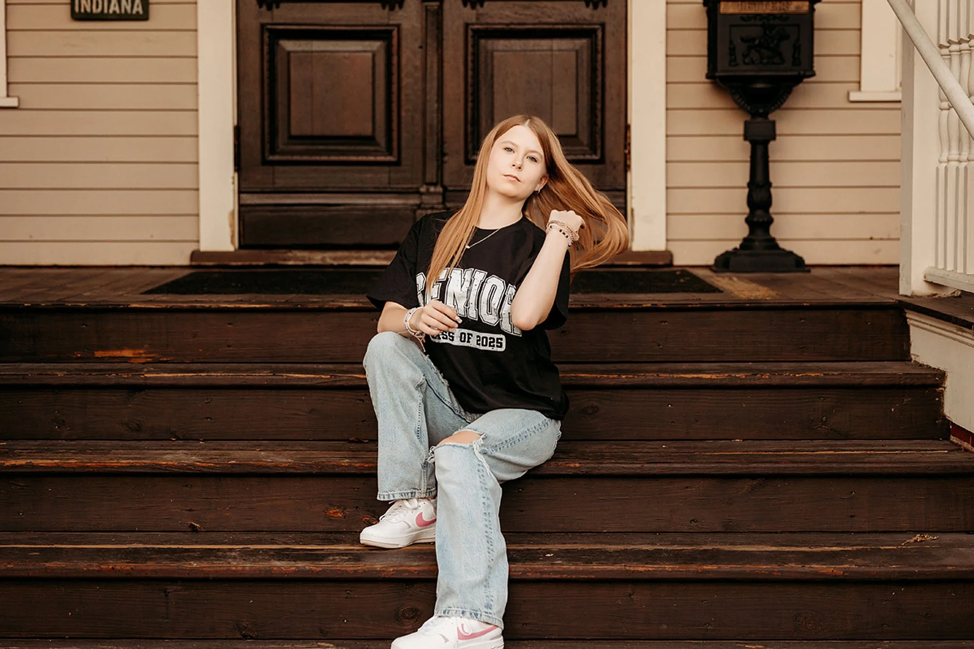 Casual Lebanon Senior Photos capturing a Class of 2025 high school senior seated on vintage porch steps with a confident pose and warm natural light