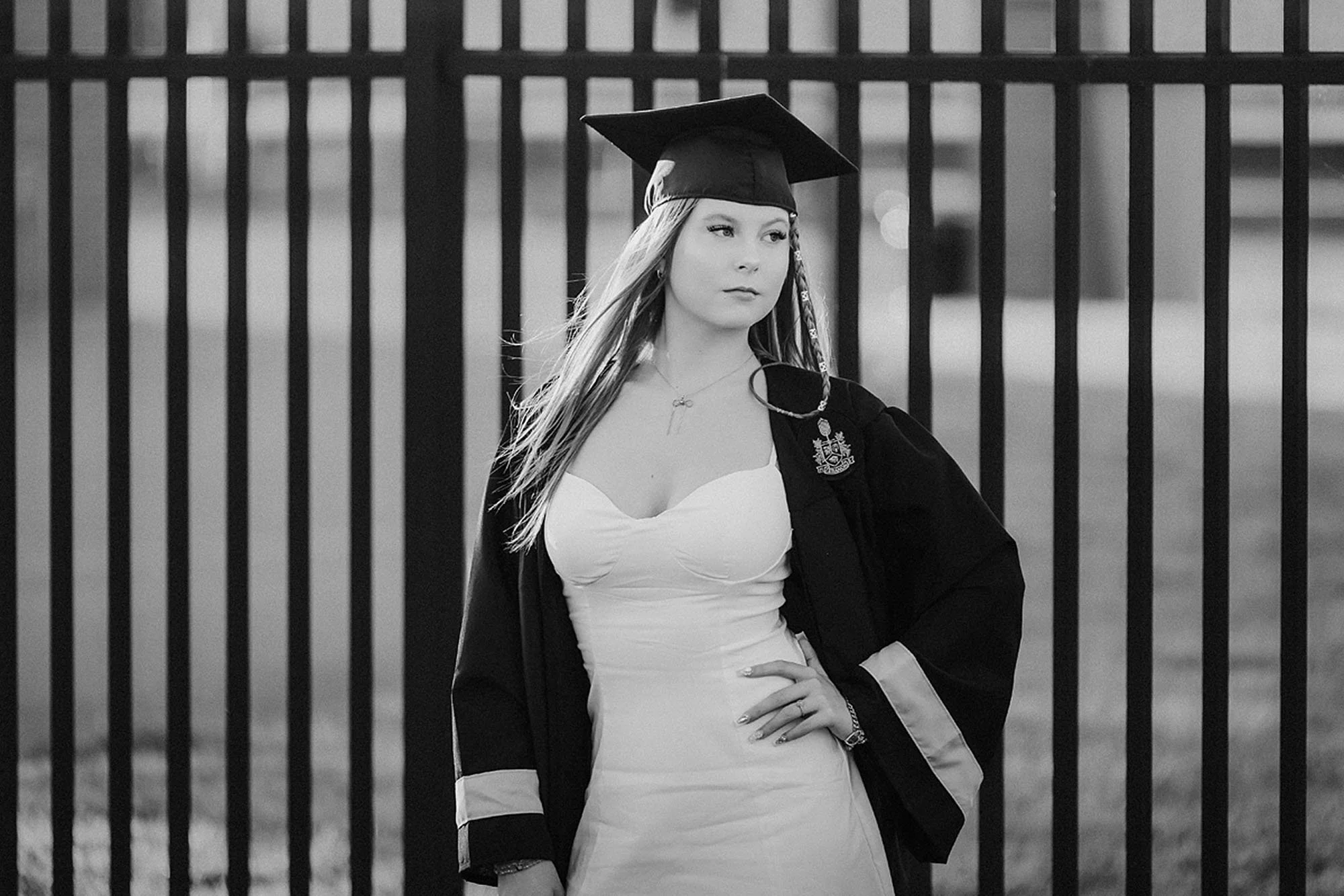 High school senior wearing a graduation cap and gown during a Lebanon Senior Photos session, photographed in a striking black-and-white outdoor portrait