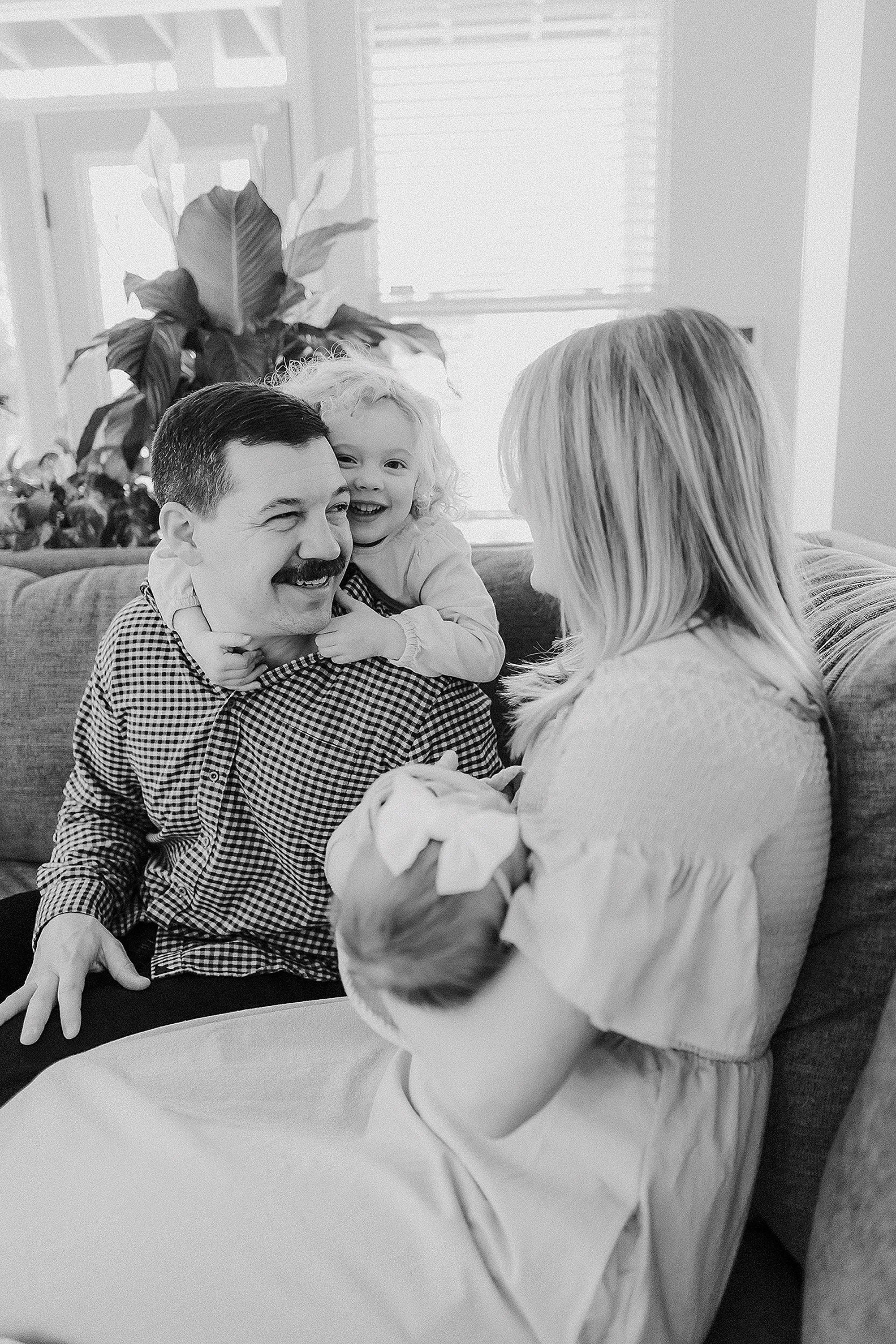 Coordinated family outfits during an in-home newborn photo session