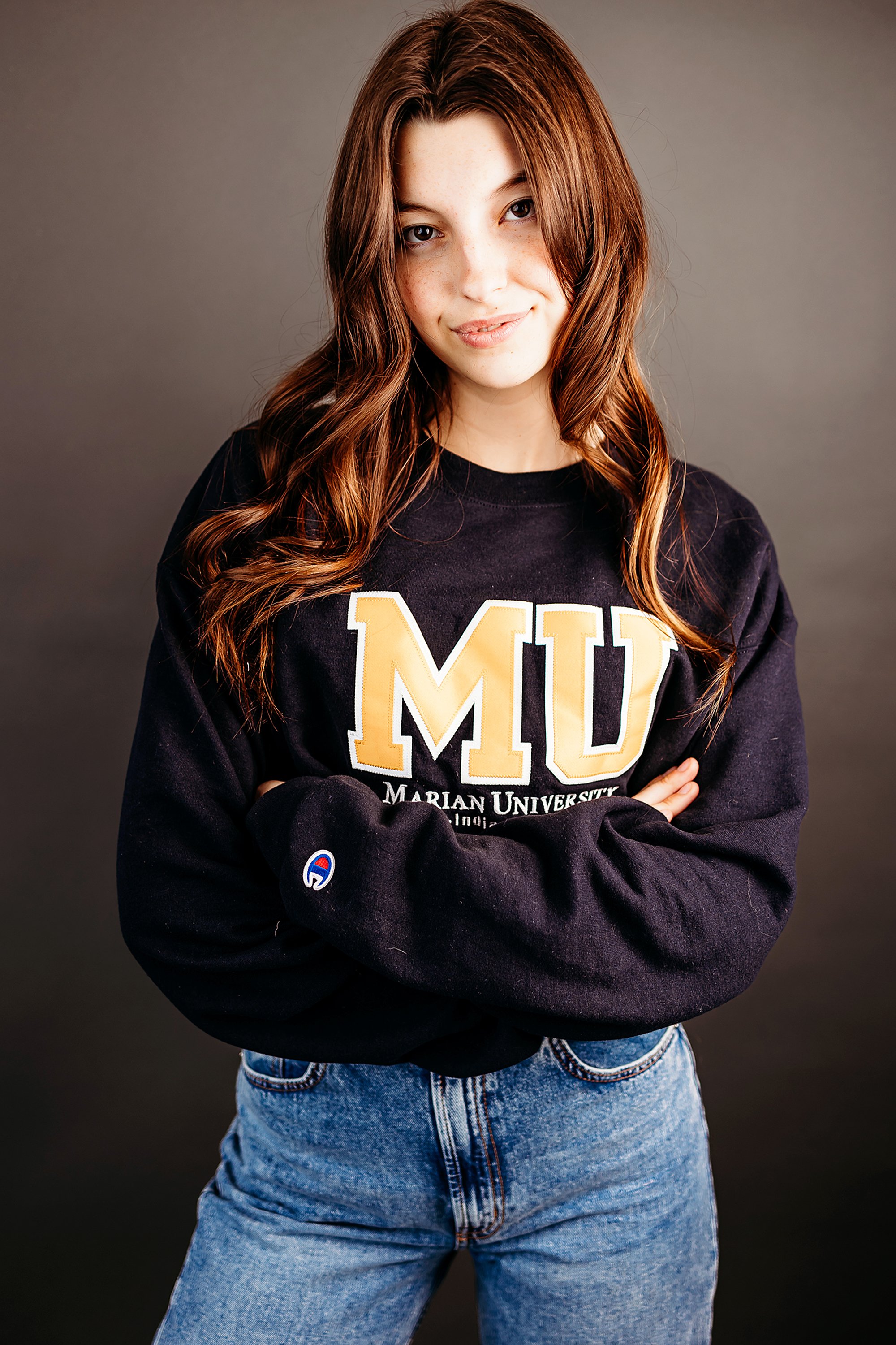 Indoor senior portrait session in Central Indiana studio with relaxed editorial pose