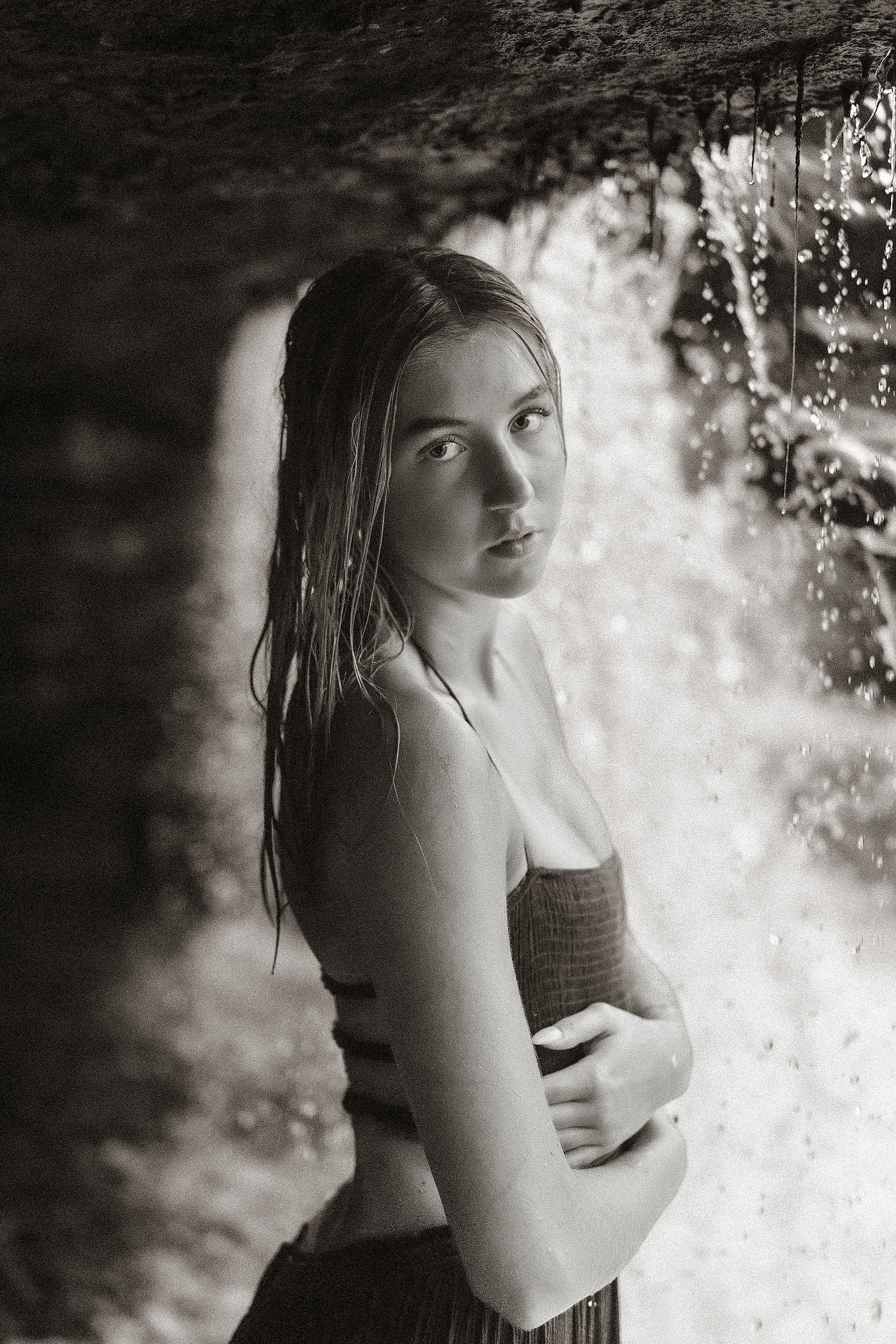 Black and white photo of Guerin Catholic Senior at Cataract falls, a unique location for senior pictures in Indianapolis