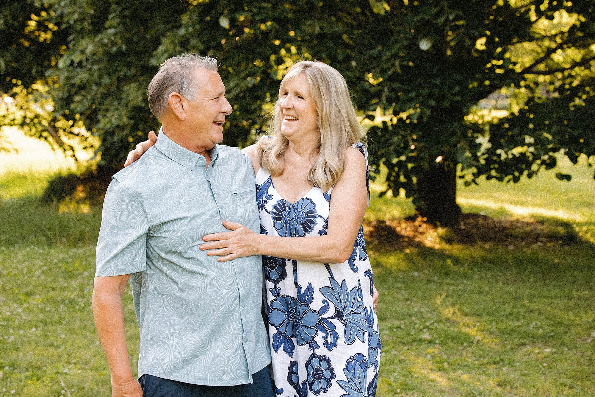 husband and wife laugh together at holliday park, photo by lauren lewis