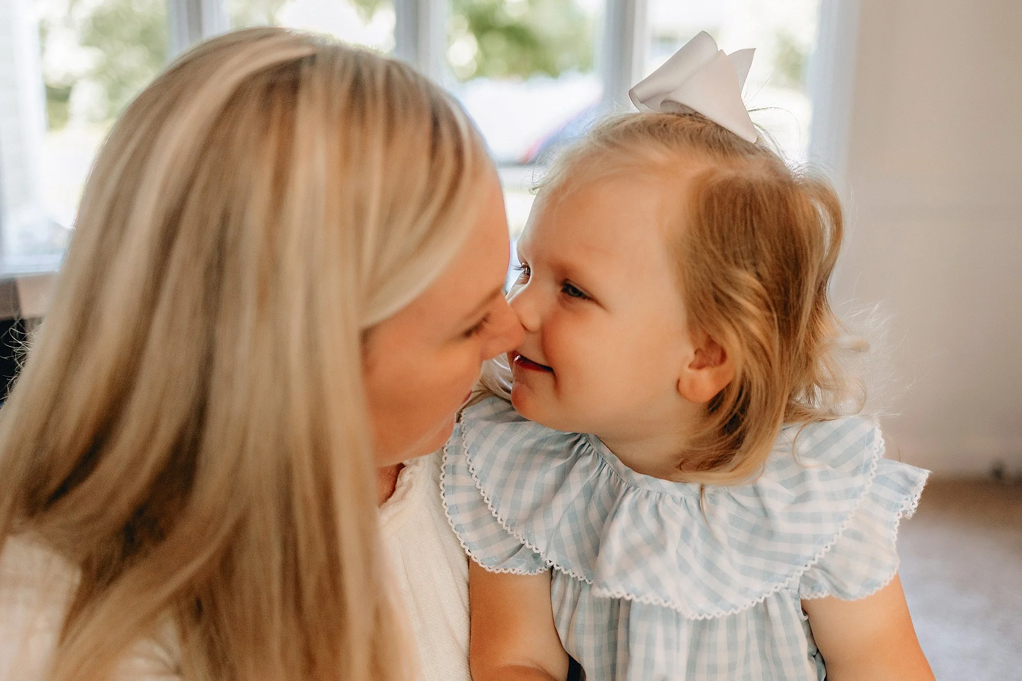Lifestyle newborn photography at home in Carmel with mother and toddler girl