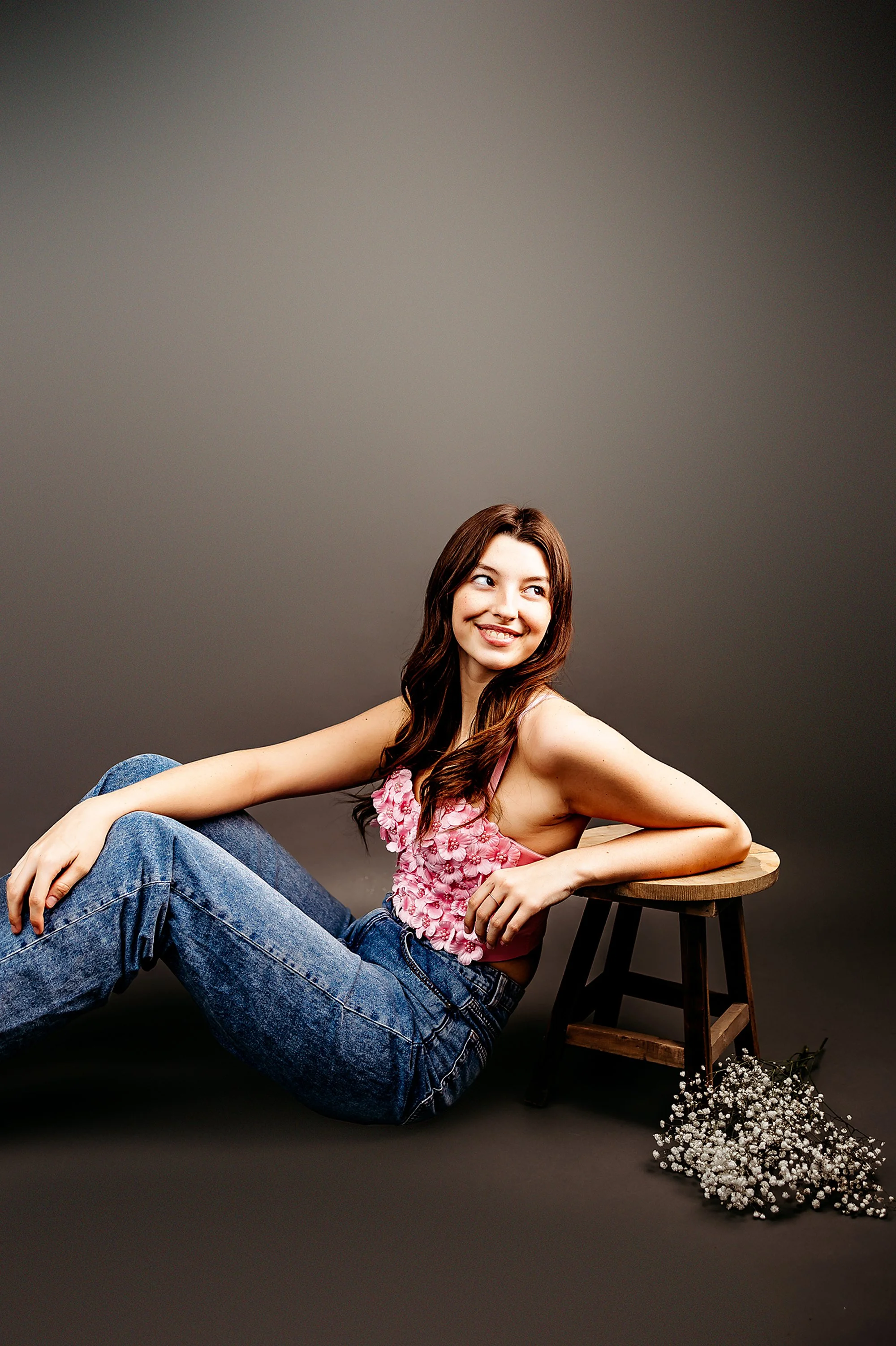 Indianapolis studio senior portrait with soft warm lighting and natural senior expression