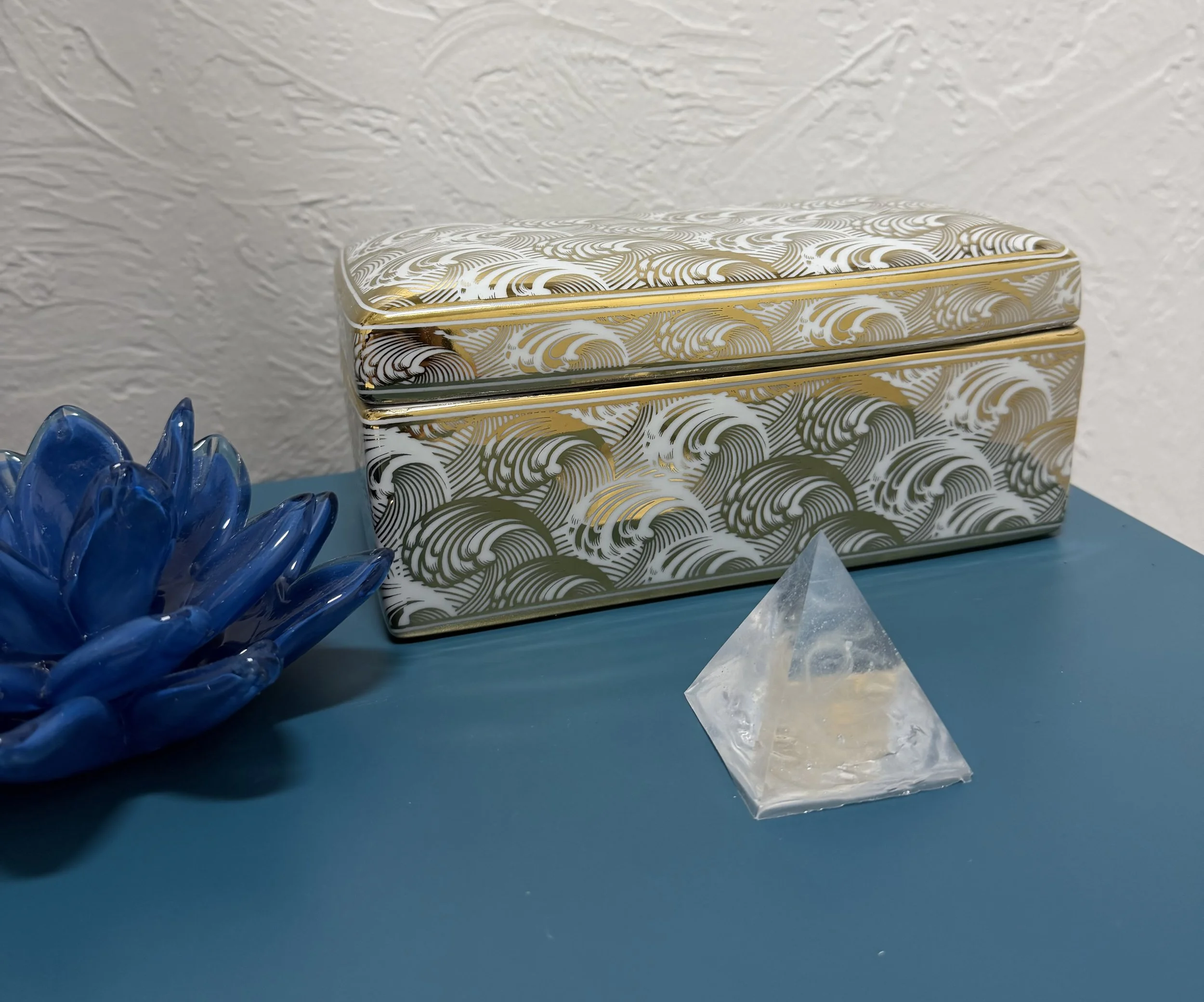 Gold and white ceramic urn with a delicate fur clipping in resin