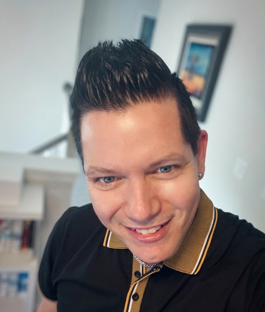 Image of Chris, Director of Customer Services and Social Media, at his office at Comforting Currents Pet Cremation.
