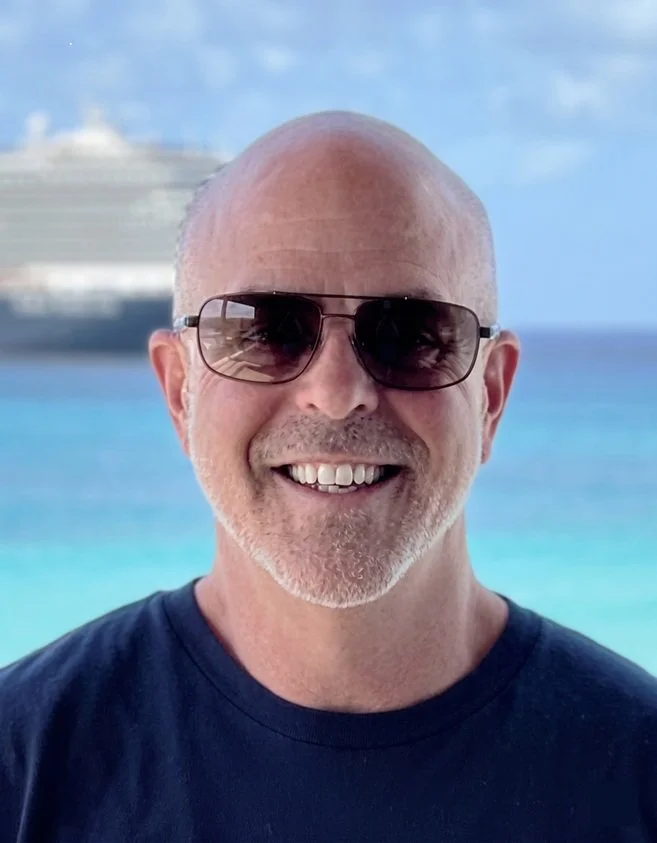 photo of Comforting Currents Director Scott with a water background