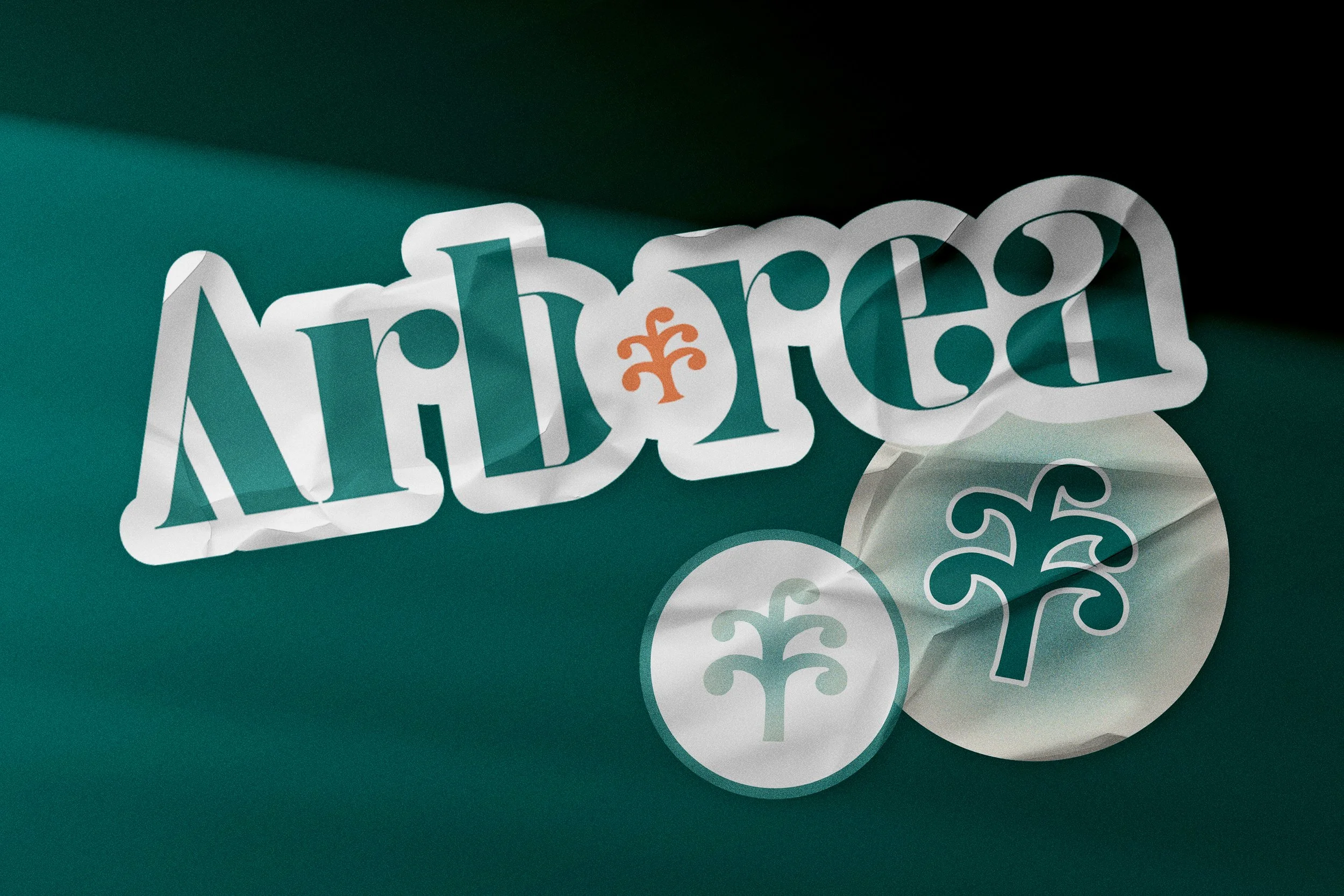 Logo d'Arboréa avec deux pièces de monnaie portant le même symbole