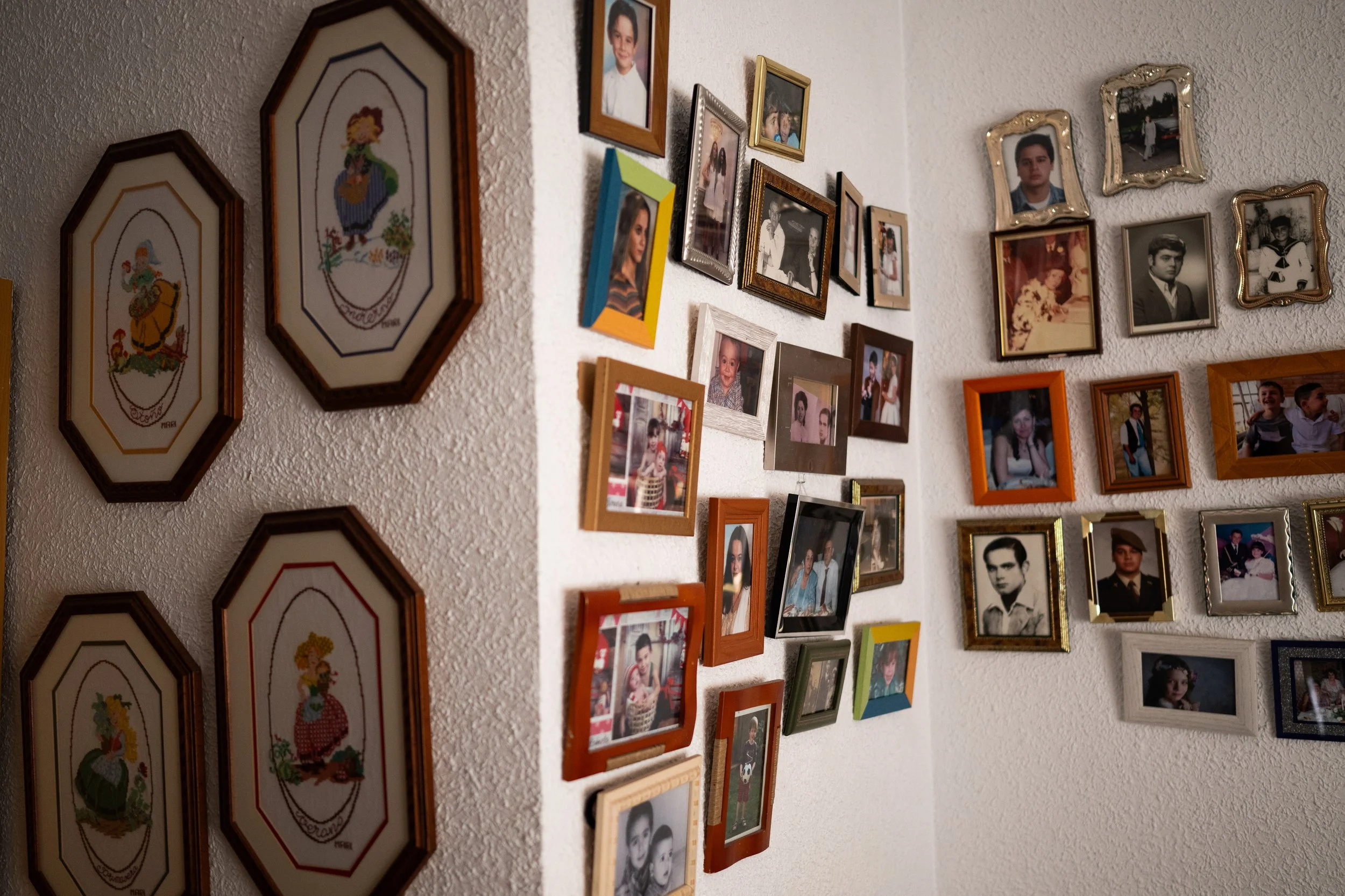 The Hangups Why do we hang things up or display certain treasures? For centuries, walls have long carried our memories — from art to religious icons to family portraits. These personal decorations keep bonds of faith, love, and identity alive. De
