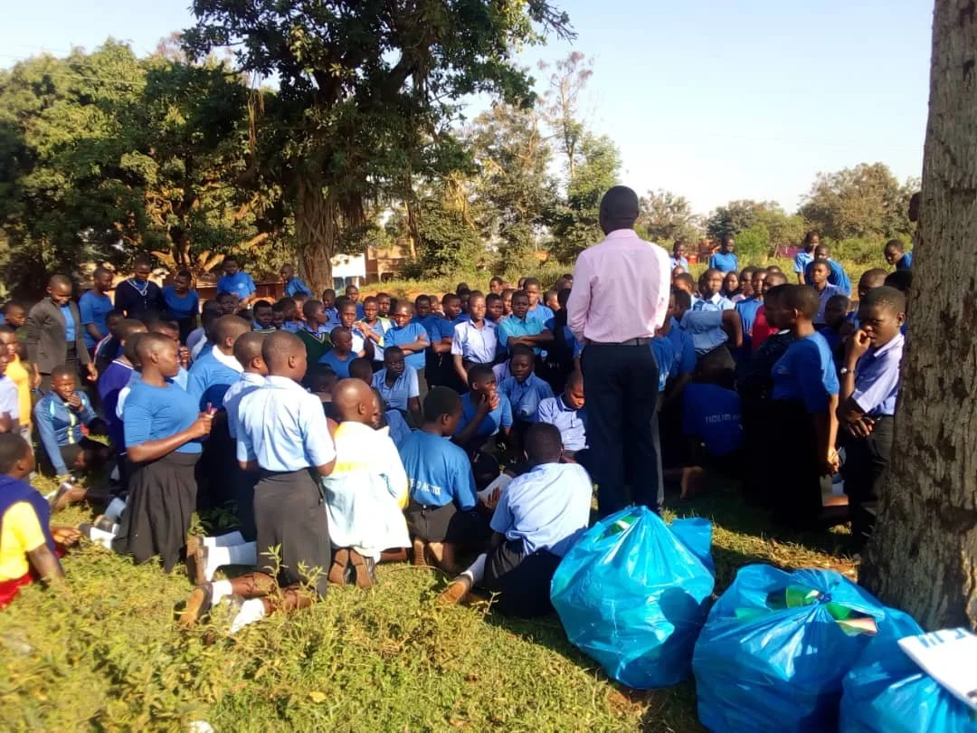 GIVING OUT SANITARY PADS.jpg