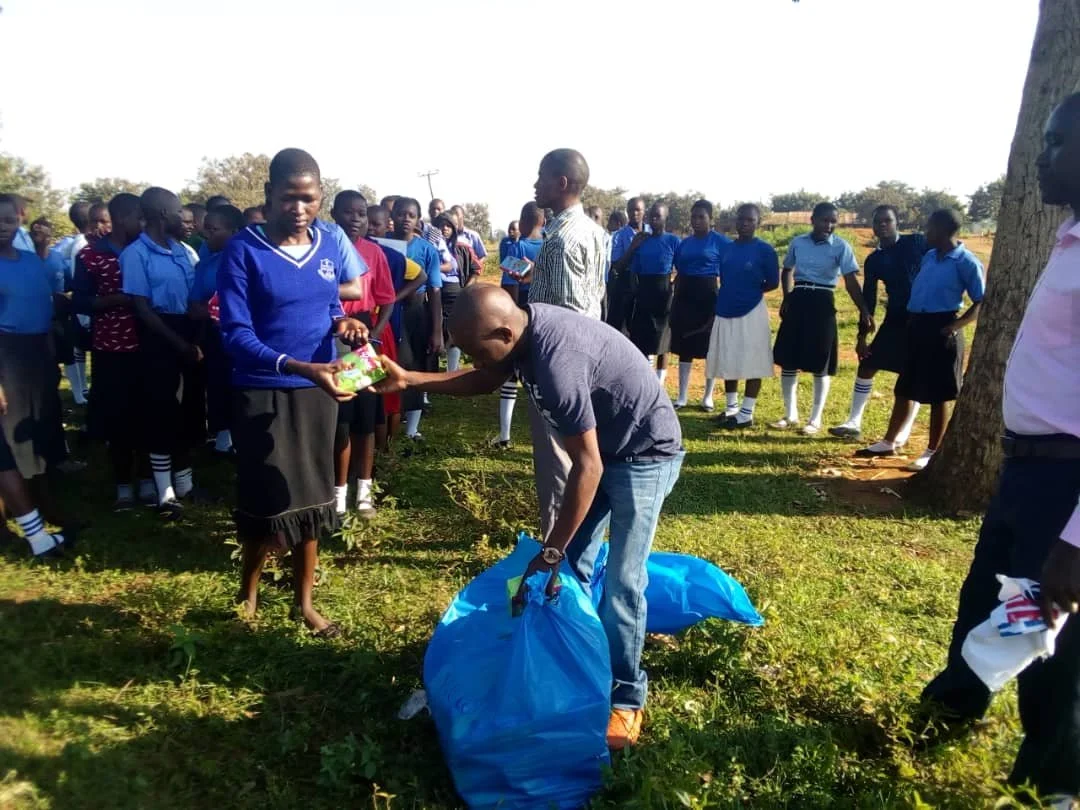 GIVING OUT SANITARY PADS.jpg.jpg