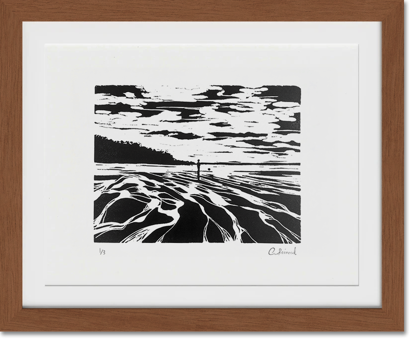 Black and white artistic landscape of a beach scene with a person standing at the shoreline, abstracted by the use of contrasting black and white, in a wooden frame.