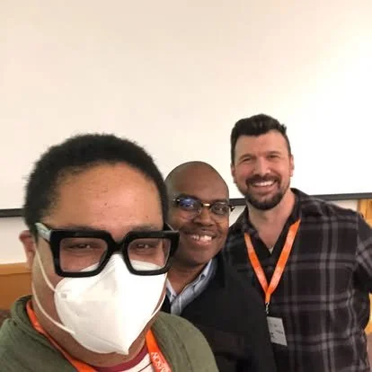 me and two collegues posing after paper presentations at academic conference