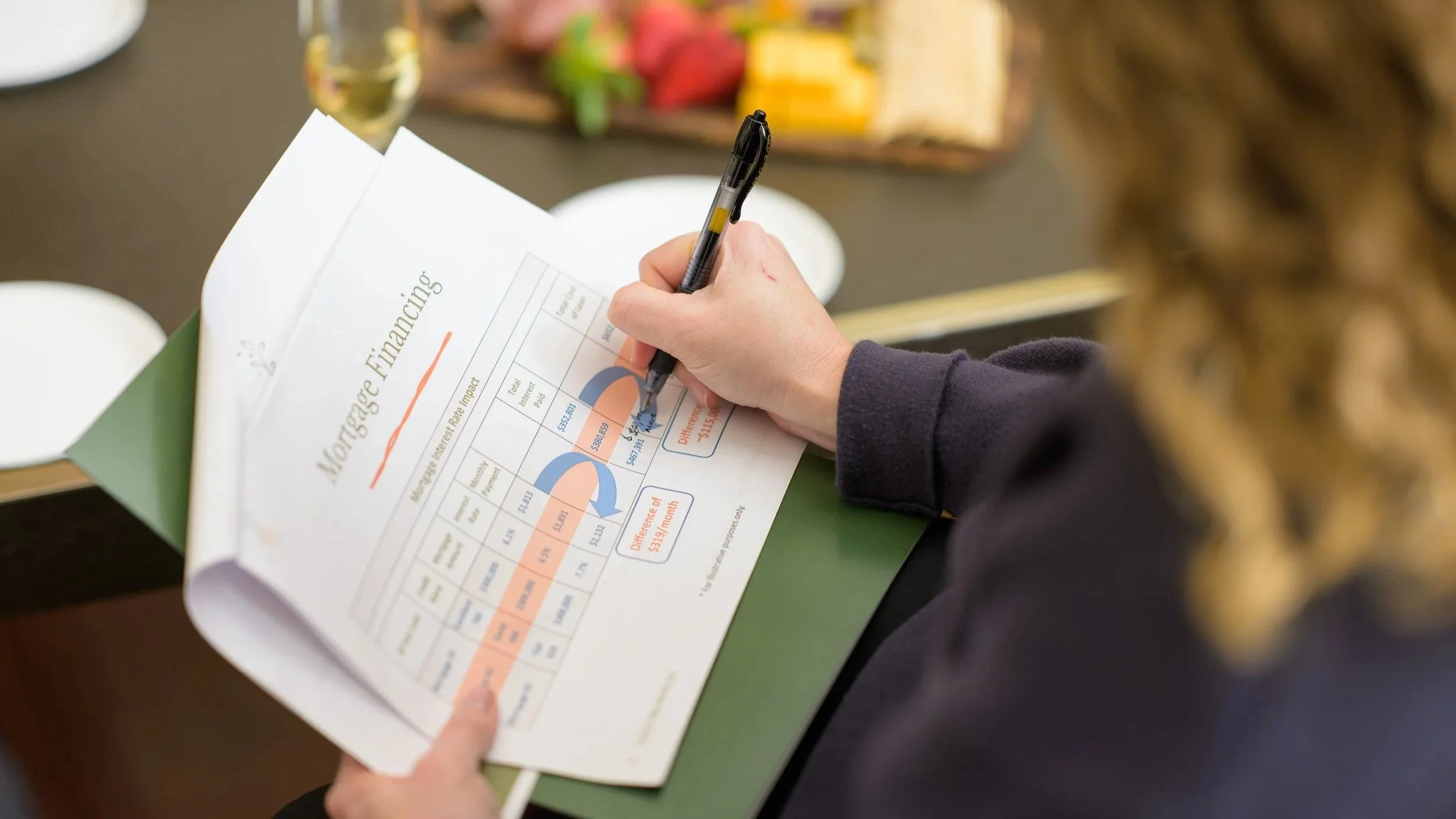 woman holding paper and writing notes