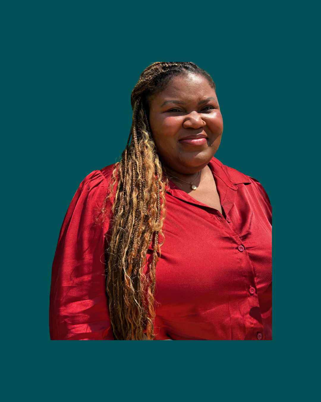 A woman with long, styled braids wearing a red button-up blouse, standing against a solid teal background.