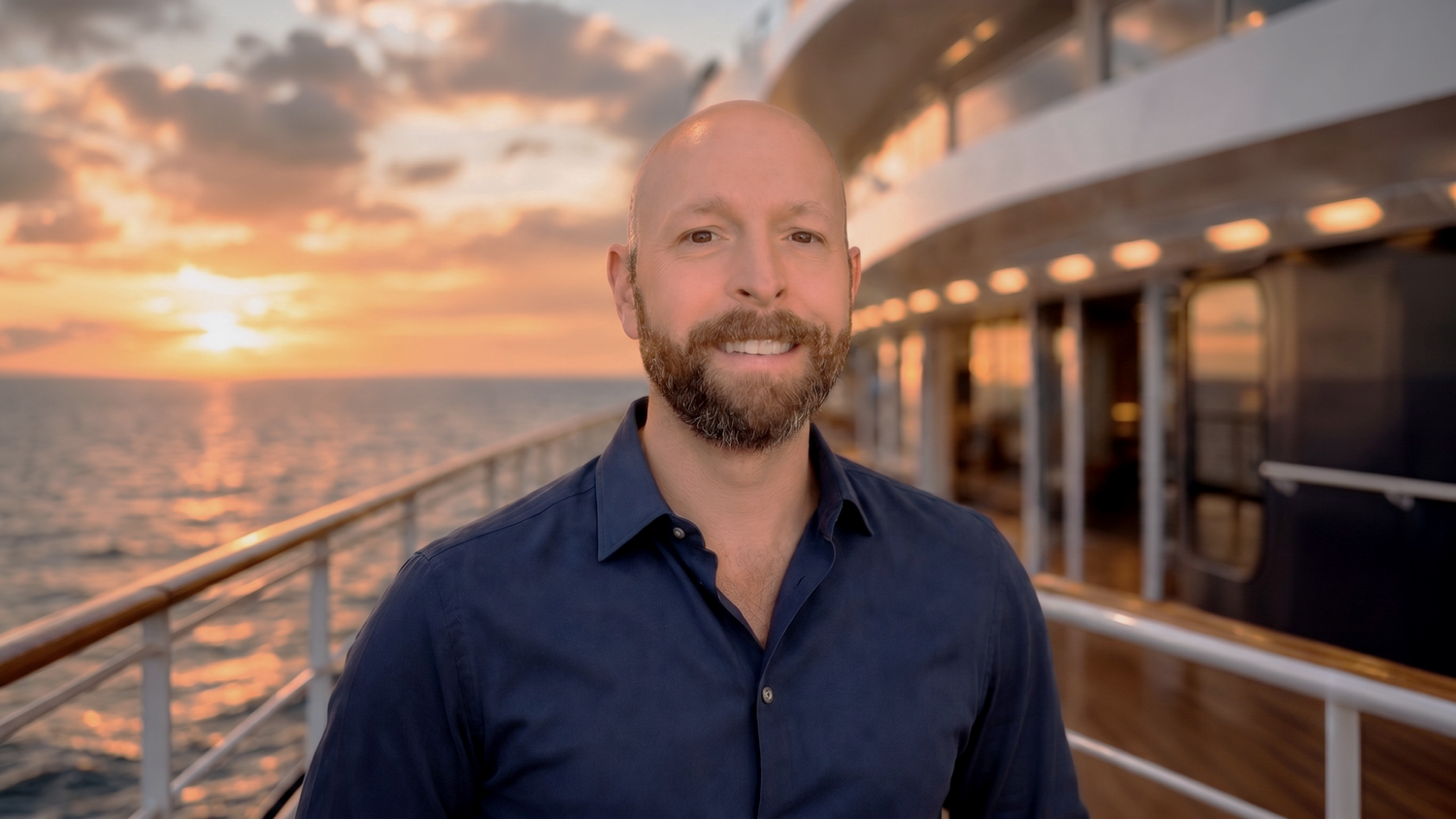 Brad on a cruise ship at sunset