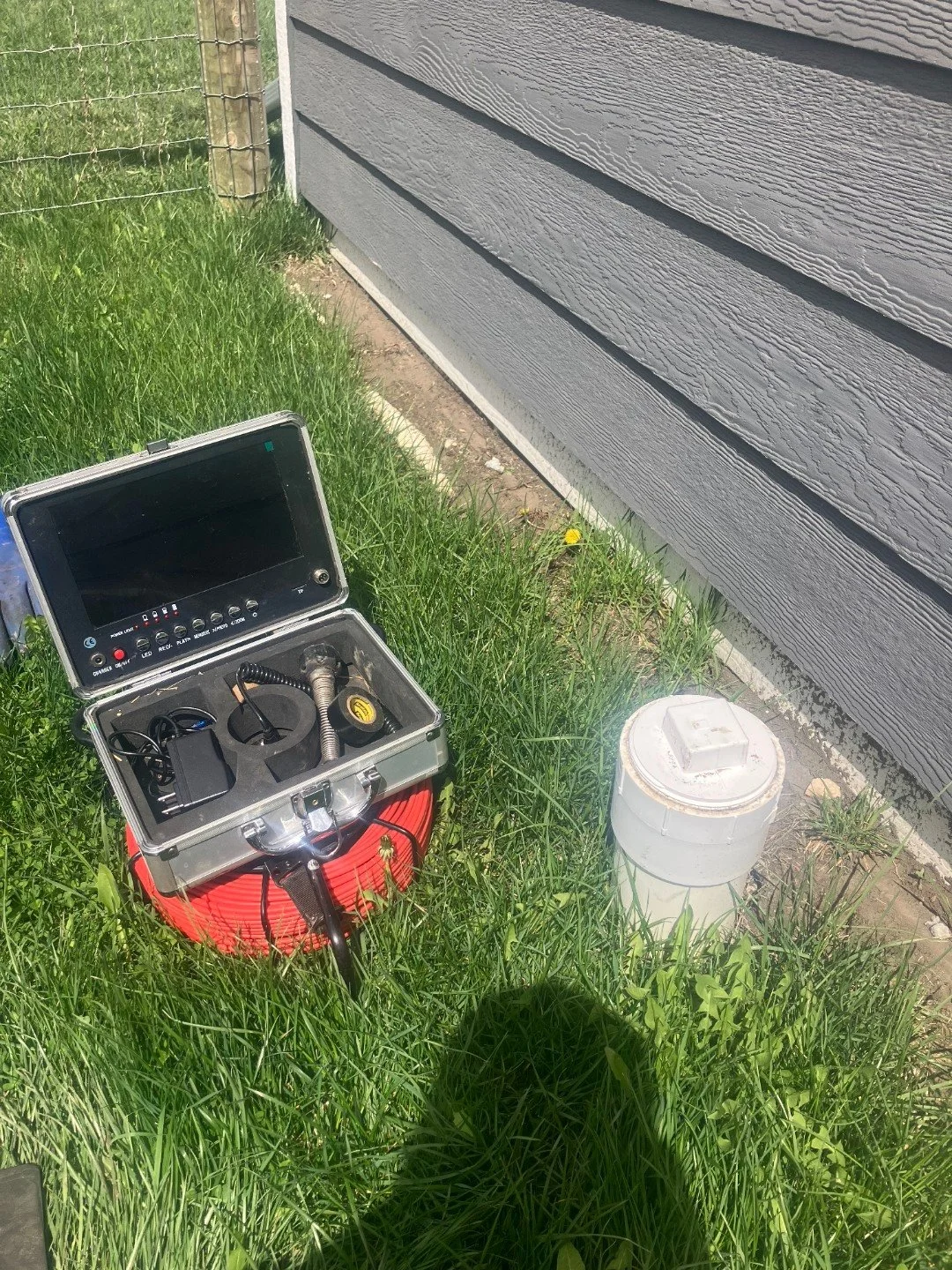 sewer line camera next to a clean out.