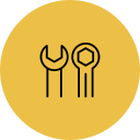 Icon of a wrench, a screwdriver, and a hammer on a yellow circular background