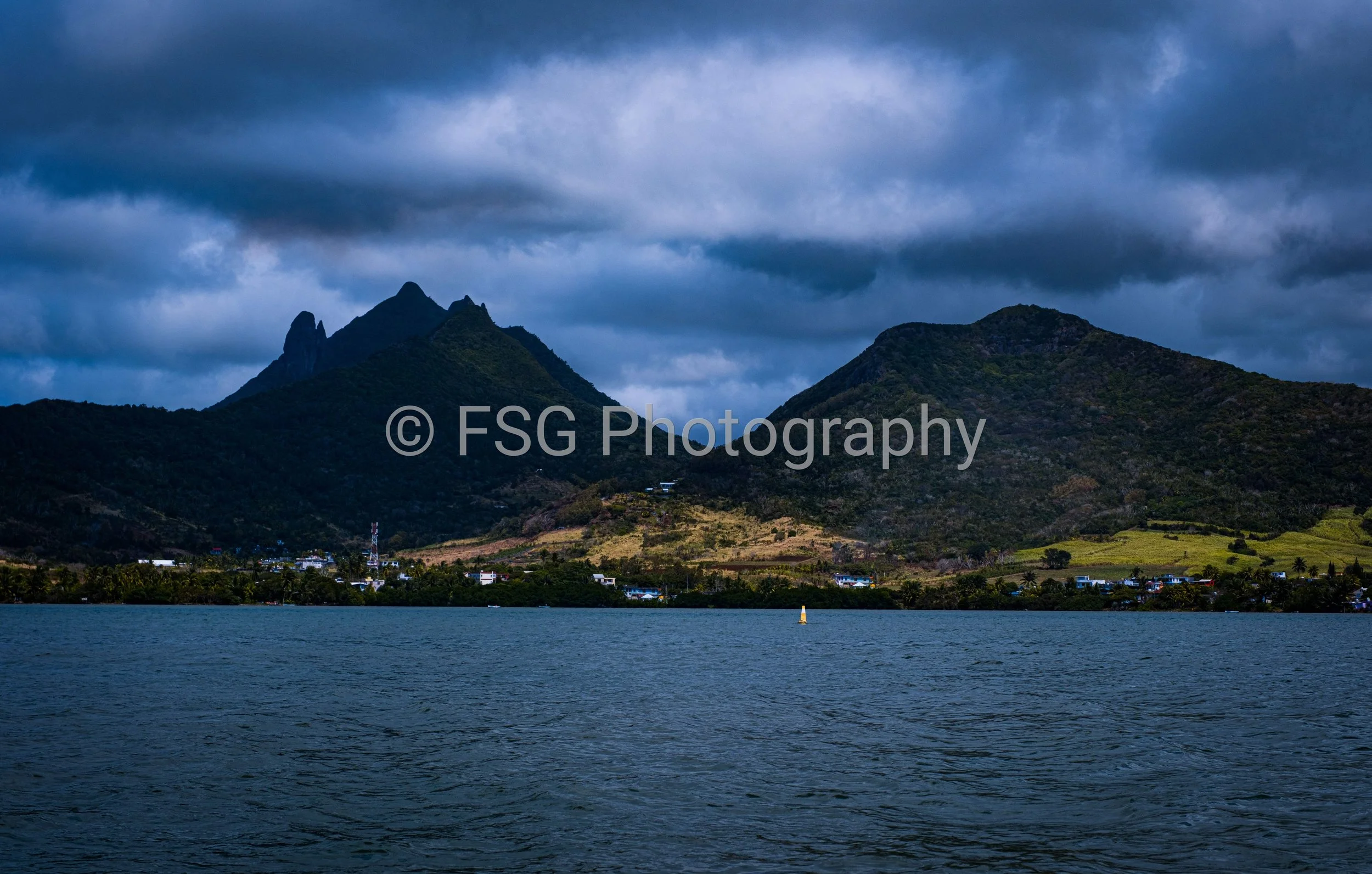 Silhouette of the Moka Range

An intimate look at the jagged peaks , defining the Mauritian horizon. Shot from the water, this perspective isolates the dramatic interface between the islands imposing basalt monoliths, and the vastness of the ocean, e