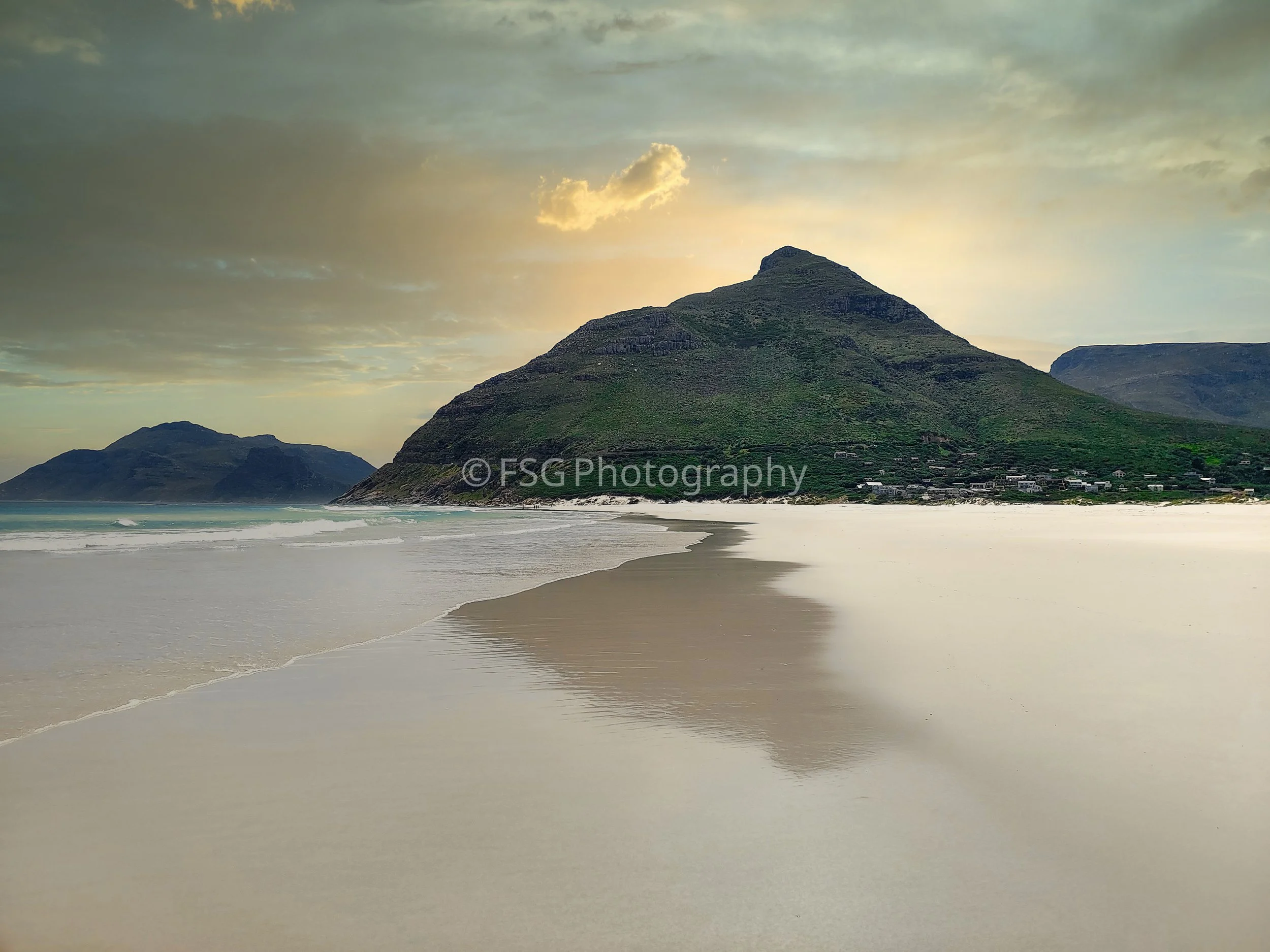 Flipped Horizon

A serene evening view capturing the raw, coastal beauty of Cape Town, South Africa. The photograph highlights the steep, fynbos-covered slopes of The Sentinel as it meets the ocean tide during a calm, glowing sunset.