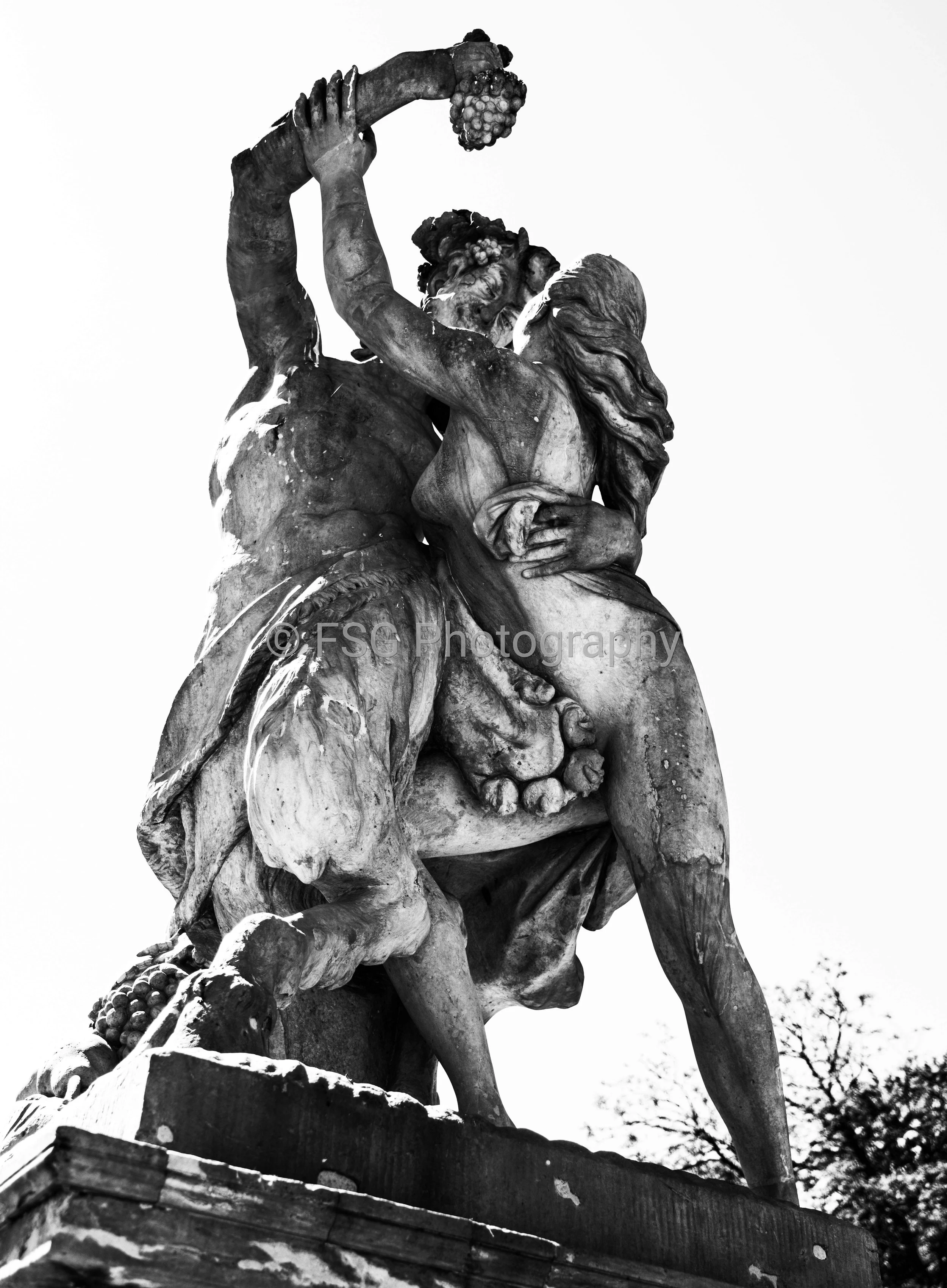 The Temptation of Bacchus

Captured in stark, high-contrast monochrome, this photograph isolates the dramatic interplay of the 18th century sandstone sculpture Satyr and Nymph. Located on the southern terrace of Warsaw's historic Palace on the Isle, 
