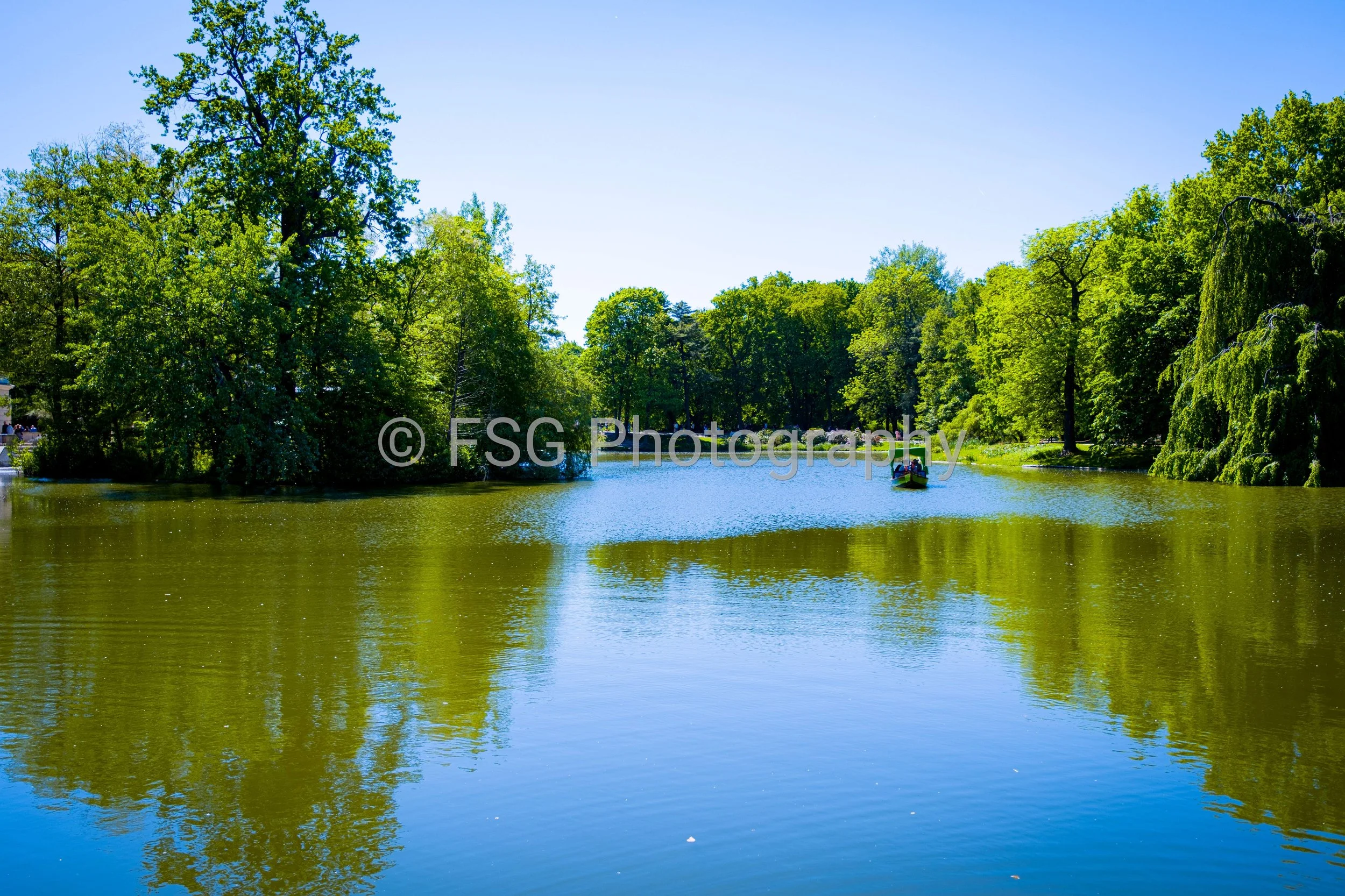 Reflections of Summer

A vibrant landscape capturing lush green trees mirrored in a still lake. The photograph depicts a classic view of nature into a bold, abstract reflection of symmetry and light.