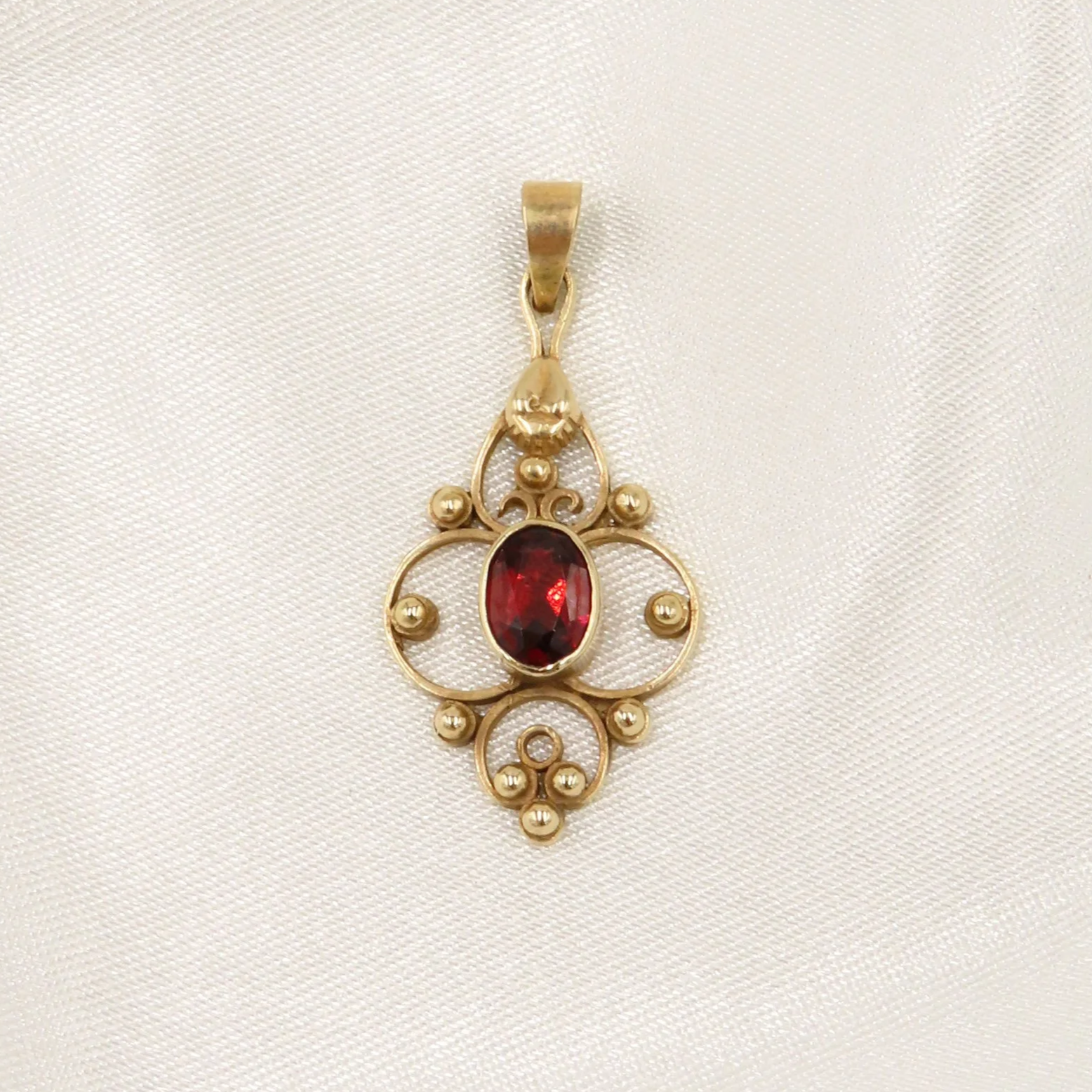 9ct Gold Garnet Open-work Pendant
