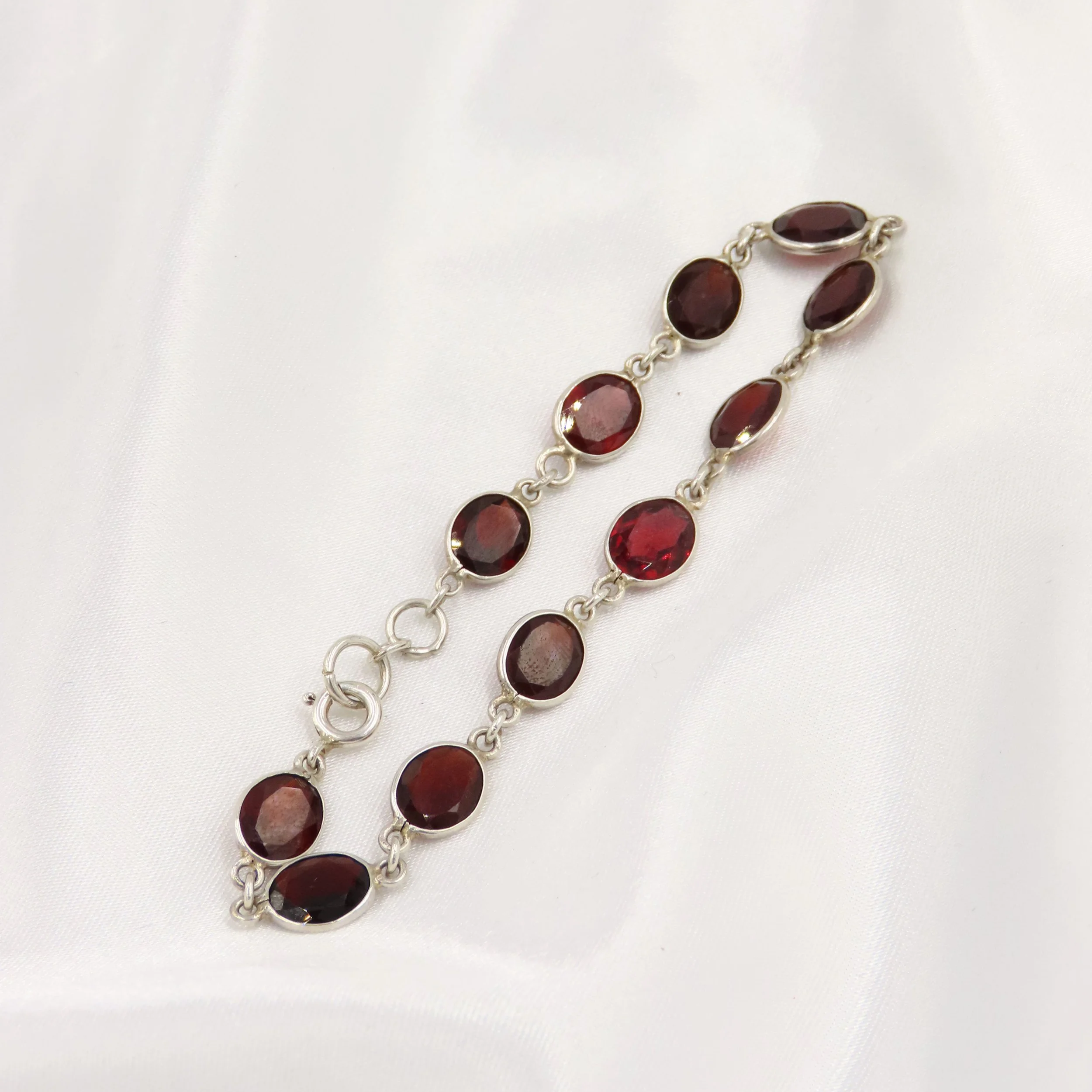 Sterling Silver Oval Cut Garnet Bezel Set Bracelet