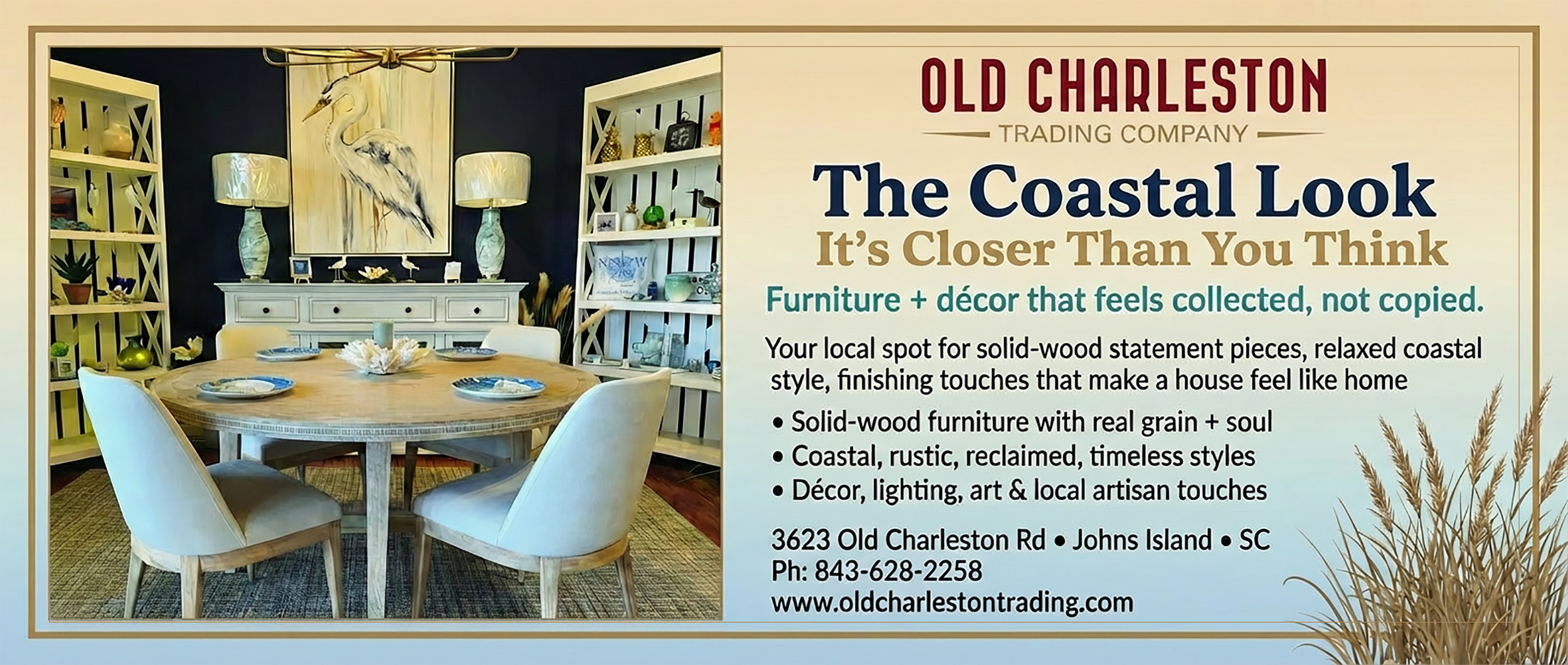Advertisement for Old Charleston Trading Company showing a coastal-themed interior with a wooden dining table, white chairs, wall art depicting a heron, and bookshelves with decorative items.
