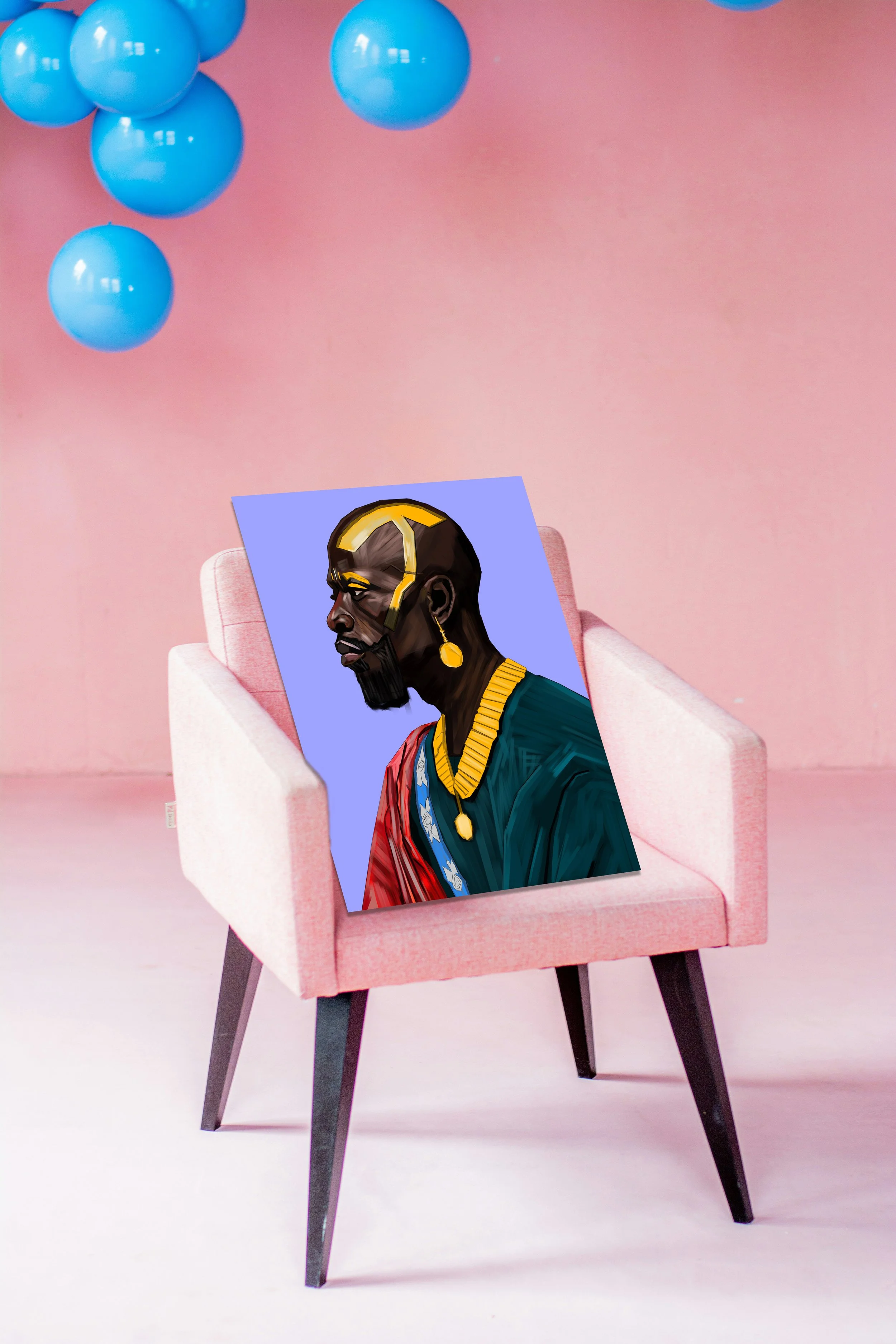 A pink armchair placed on a pink floor with blue balloons hanging in the background. A digital artwork of a stylized portrait of a man with dark skin, wearing gold jewelry and a traditional outfit, leans against the armrest of the chair.