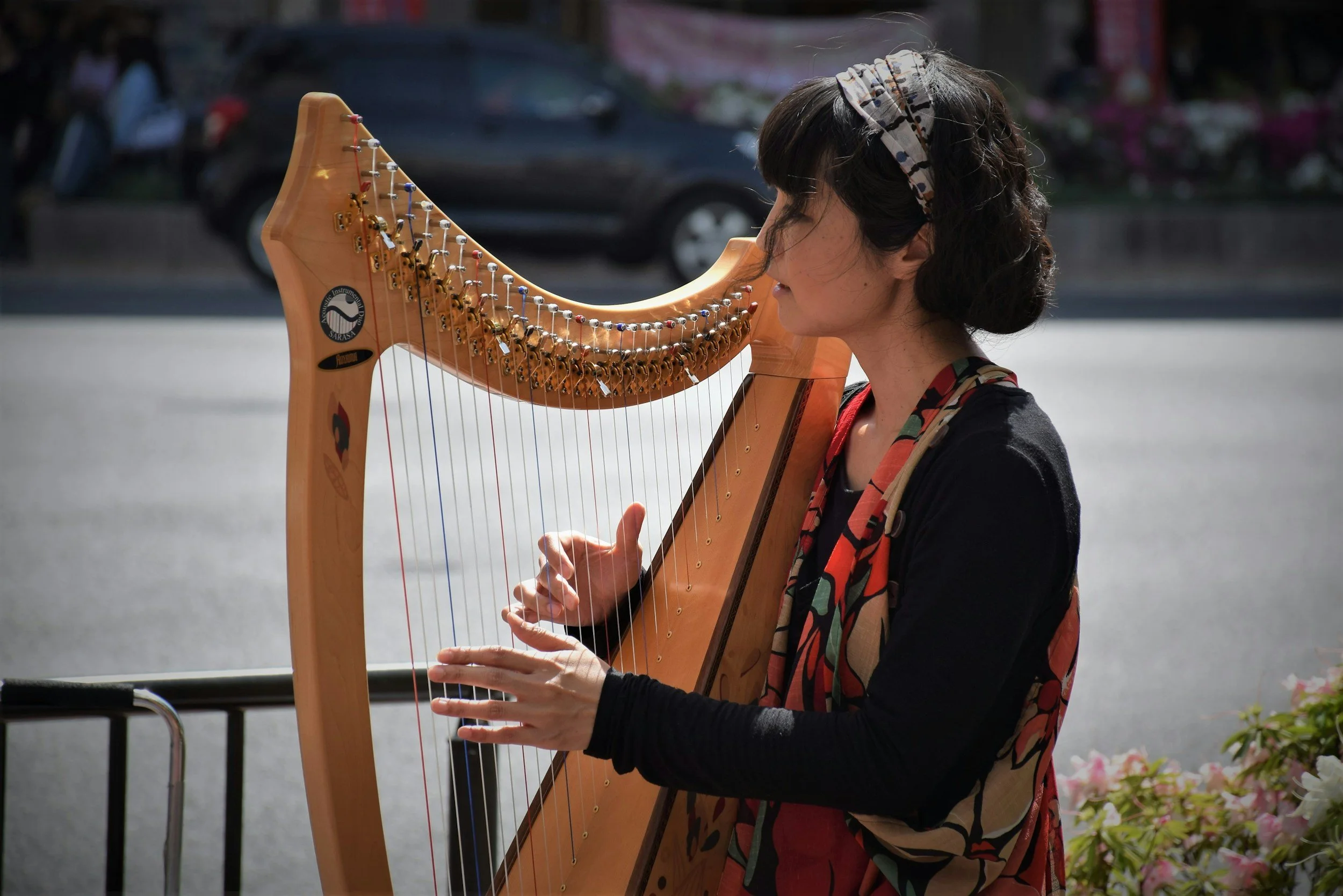 A women playing a harp