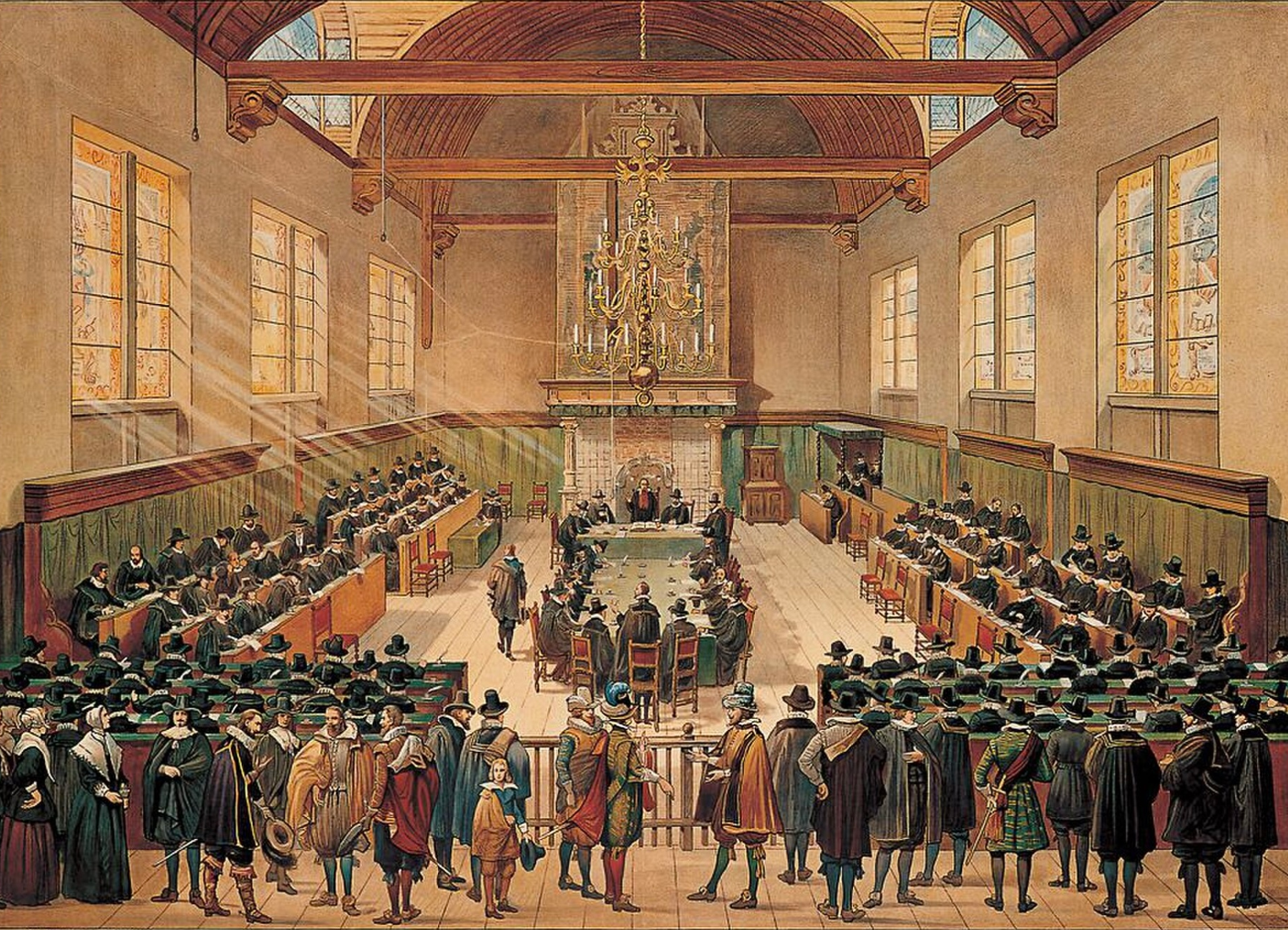 A historical painting of the Synod of Dort inside a grand hall with high arched wooden ceiling, large windows, and a chandelier. Several men are gathered around a central table, with some standing and others sitting, engaged in a debate.