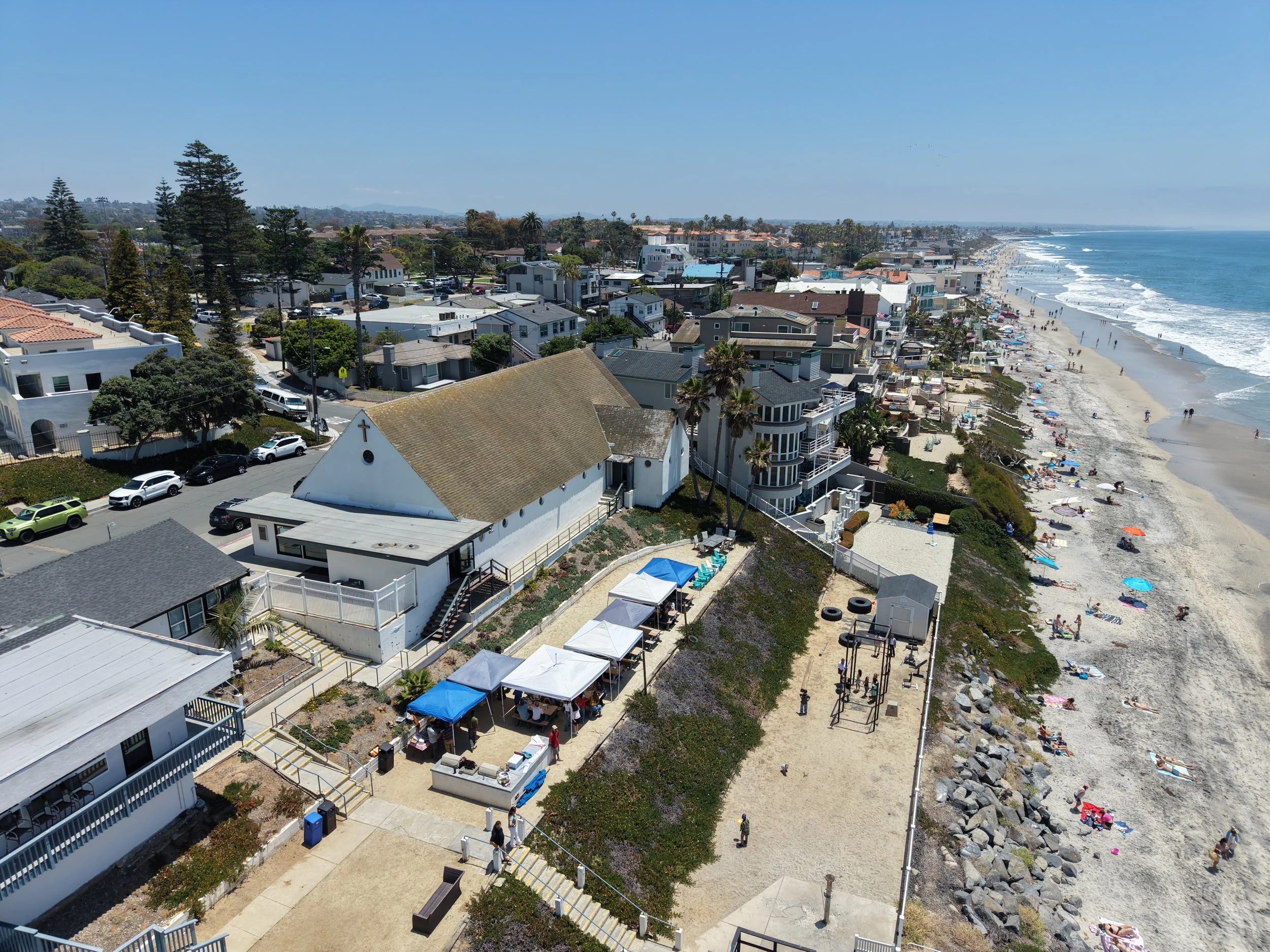 Aerial view of the Army and Navy Academy chapel on the bluff above the beach in Carlsbad