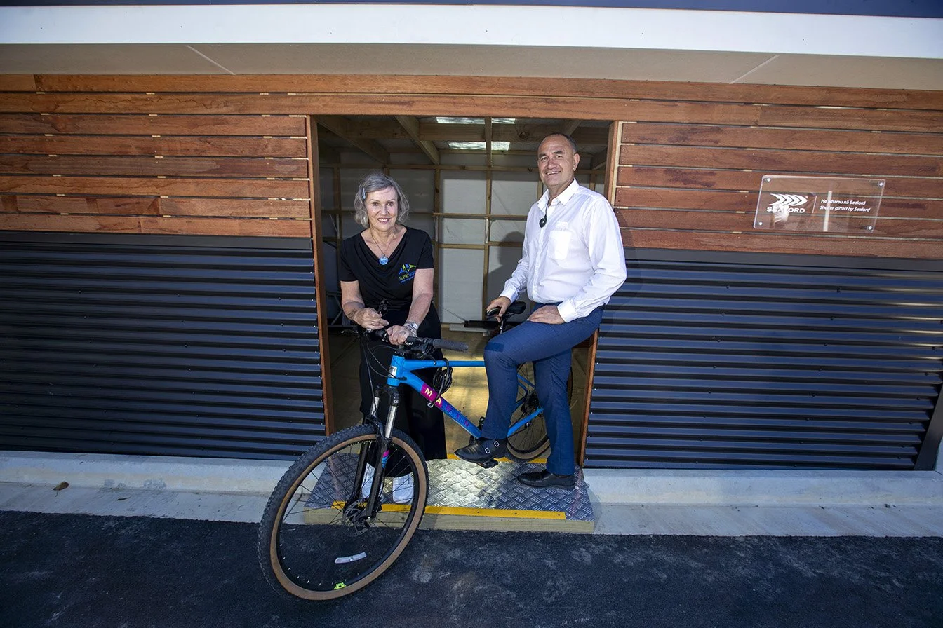 Anne Hobby and Doug Paulin in front of the new bike shed