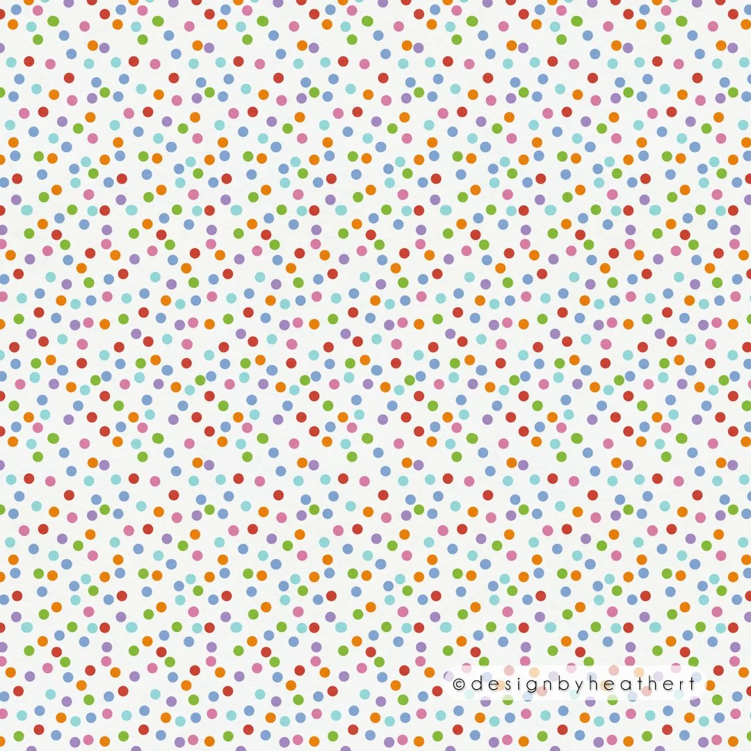 Randomly placed, brightly colored small polka dots against white.