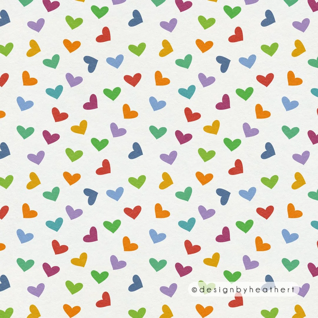 A scatter of hearts in colors like those of the polka dots, against white.