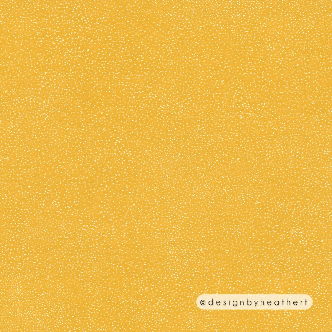 Random white dots against deep yellow