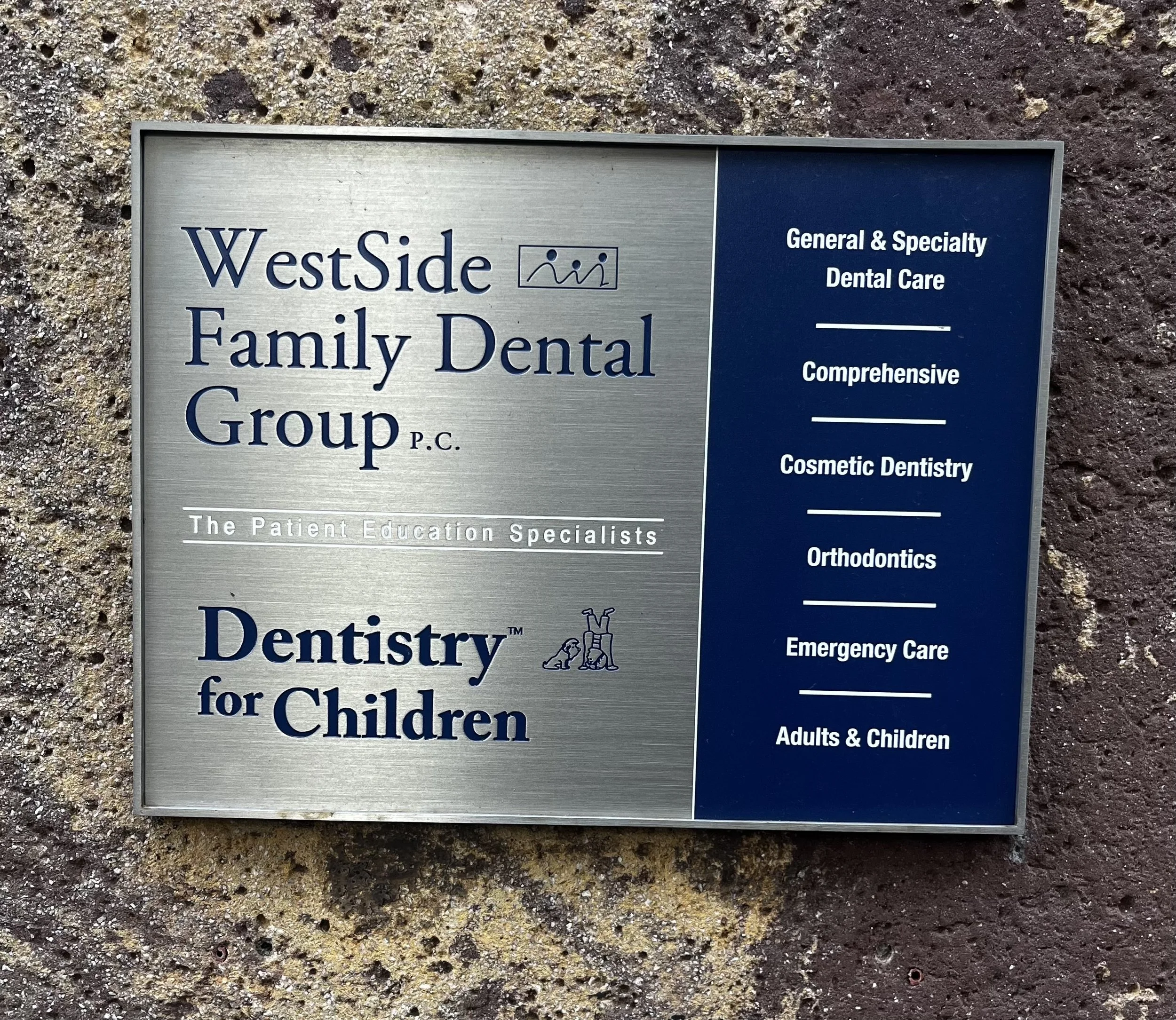Sign for WestSide Family Dental Group, a dental practice offering general, specialty, cosmetic, orthodontic, emergency, and adult and children dental services.