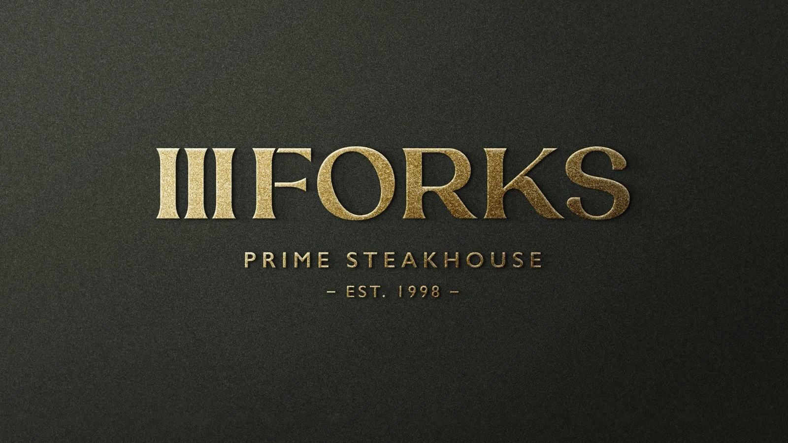Black background with gold text reading 'FORKS PRIME STEAKHOUSE EST. 1998'.