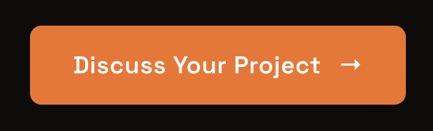 Orange button with white text that says 'Discuss Your Project' and a right arrow icon