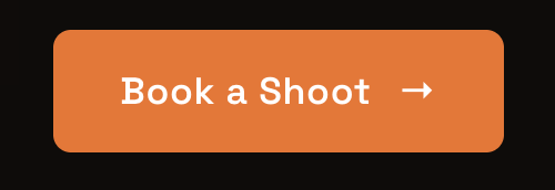 Orange button with white text that says 'Book a Shoot' and a right arrow.