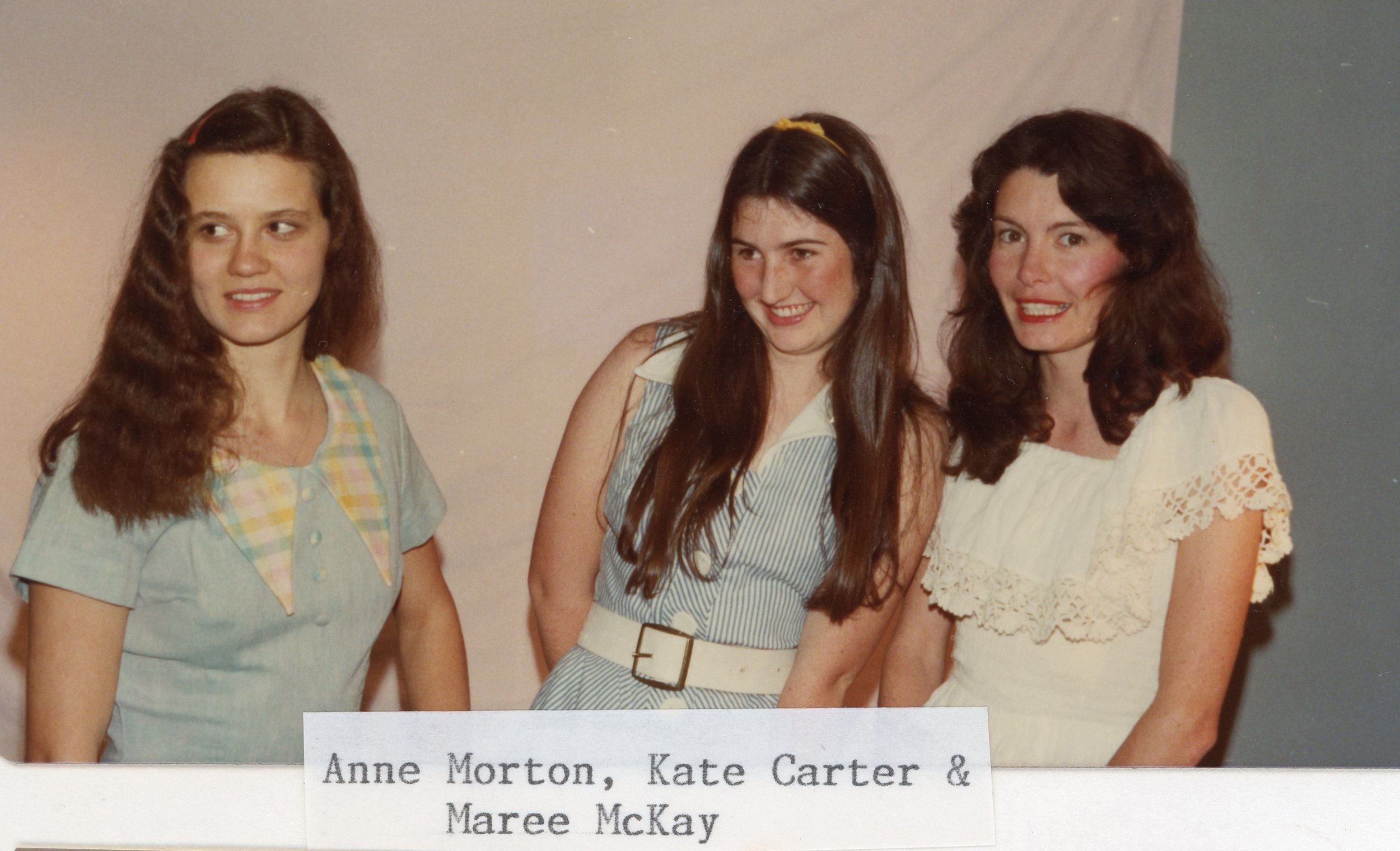 A vintage photo of three women smiling, labeled as Anne Morton, Kate Carter, and Maree McKay.