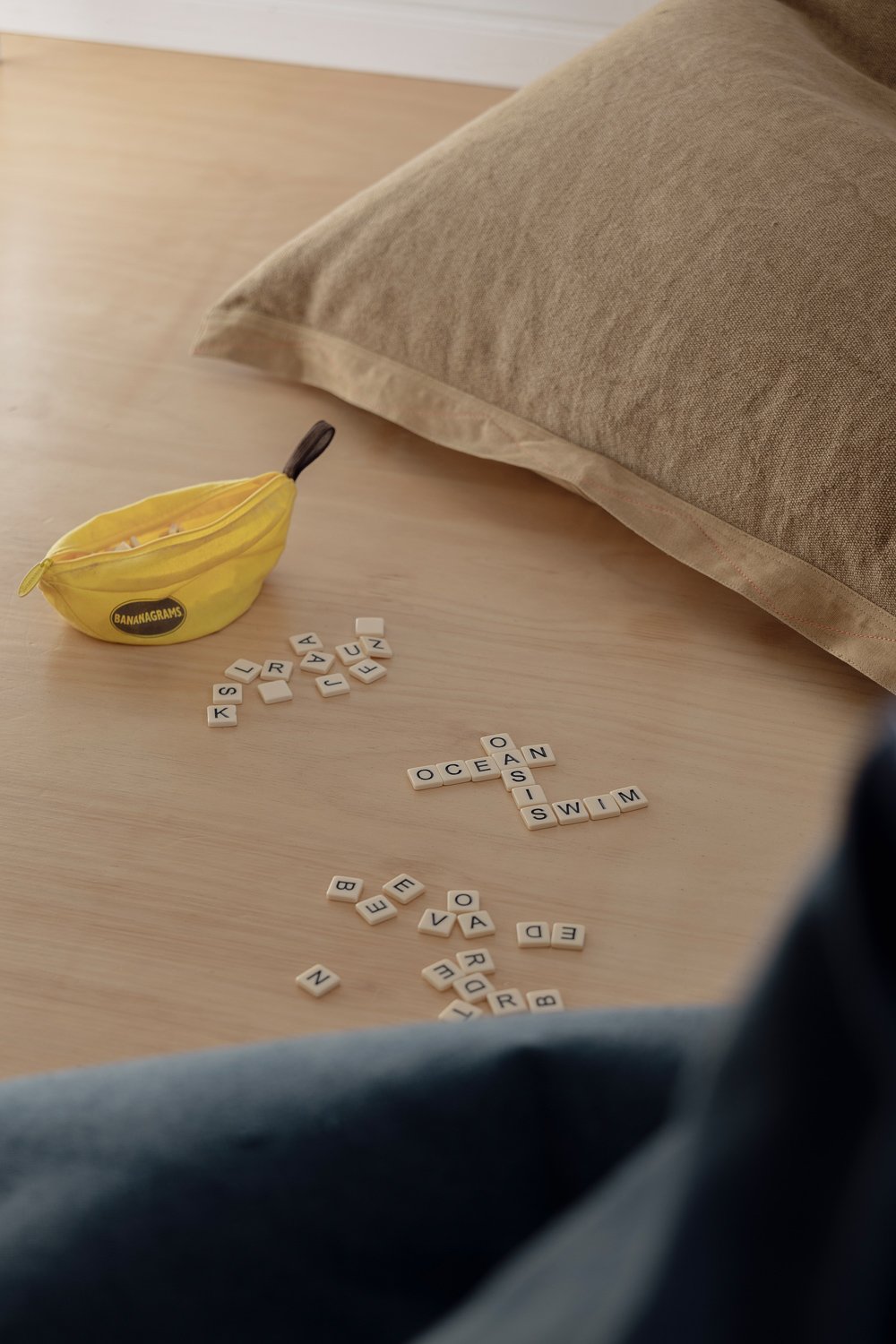 Detail of Bananagram's game with two kids' bean bags 