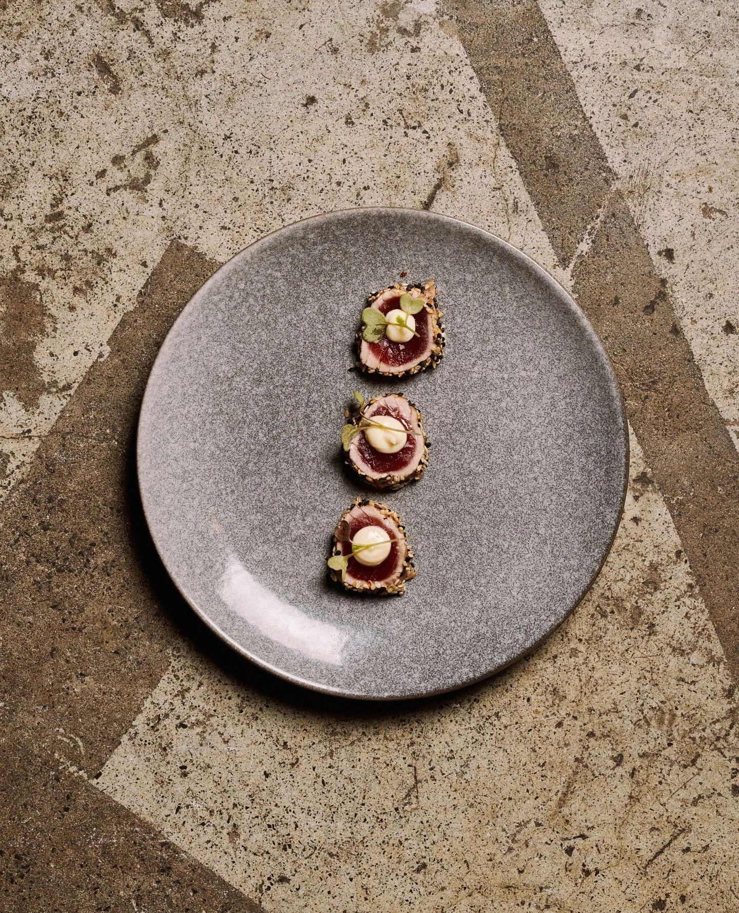 SESAME TUNA TATAKI⁠
⁠
Lightly seared sesame-crusted tuna, paired with a sharp wasabi mayonnaise and crisp radish sprouts.⁠
Each bite is layered with texture, freshness, and subtle heat&mdash;balanced, refined, and effortlessly indulgent.⁠
⁠
A dish cr