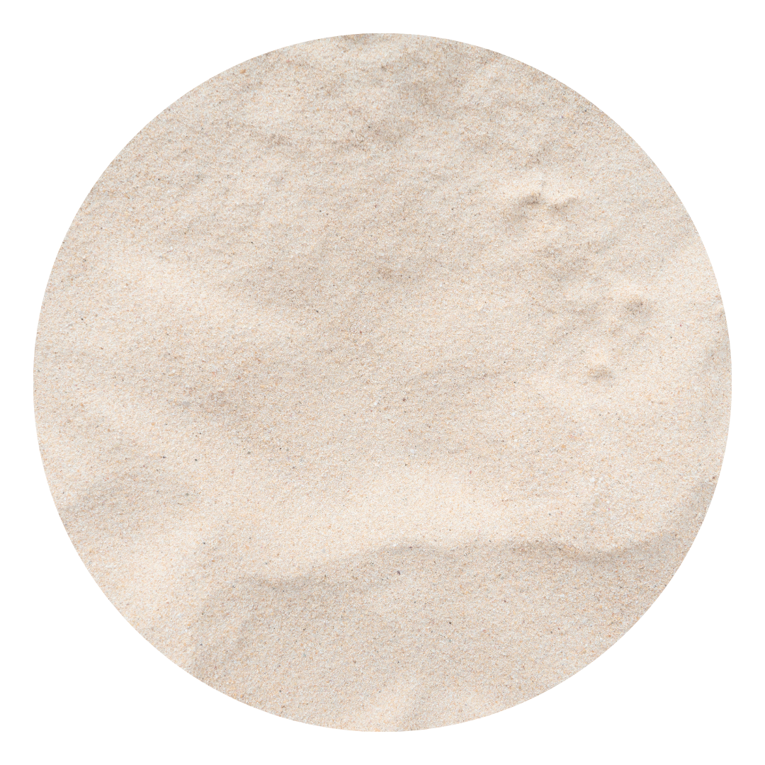 Close-up of light-colored sand in a circular shape.
