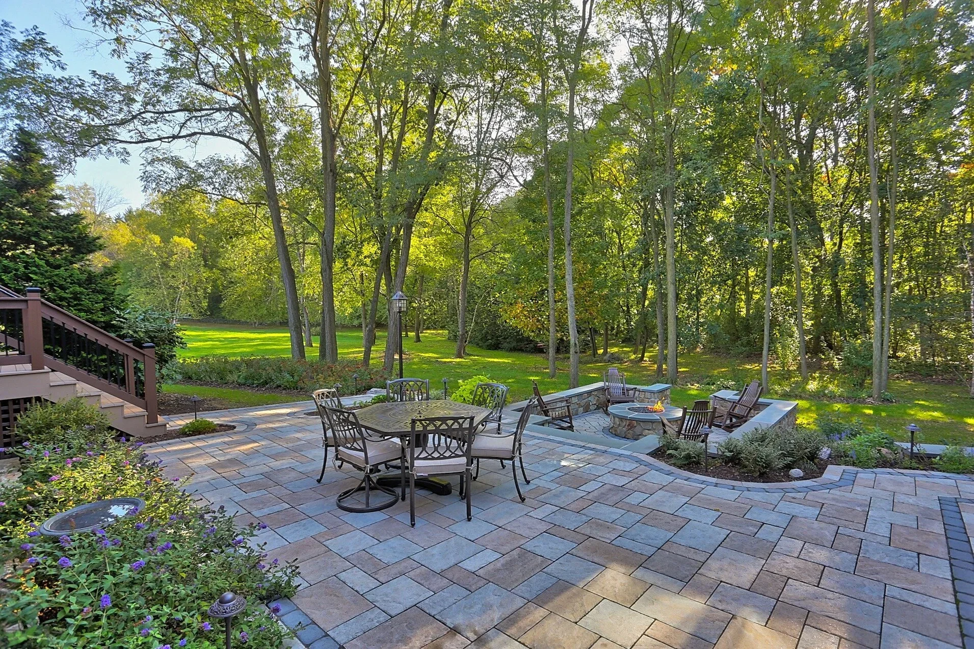 Paved backyard patio and fire pit